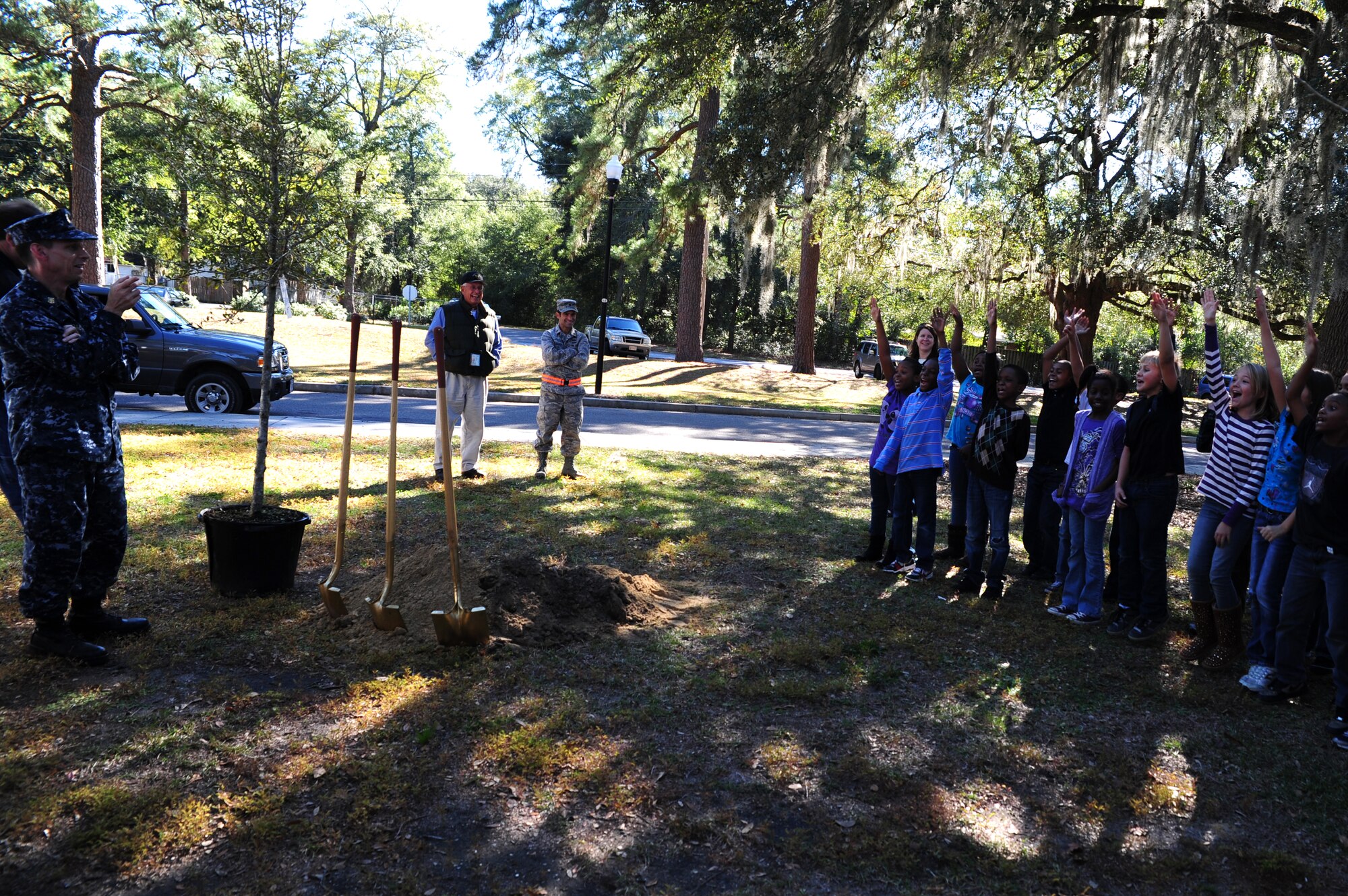 Master Chief Petty Officer Billy Cady picks  students to help plant a tree for Arbor Day   at Hunley Park Elementary School in North Charleston Dec. 2. This is the 16th year JB Charleston has been a member of the Tree City USA foundation. To become a Tree City USA member, a community most meet four annual standards:  a tree protection board or manager, a tree care ordinance, a comprehensive community forestry program and an Arbor Day observance.  Cady is the JB Charleston - Weapons Station command master chief.  (U.S. Air Force photo/ Staff Sgt. Nicole Mickle) 