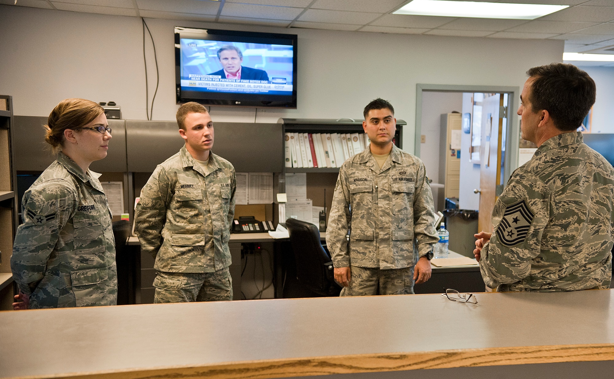 Chief Master Sgt. Steven Bohannon, 3rd Wing command chief, talks to Airmen from Base Operations during his visit Nov. 30, 2011. The command chief visits shops throughout the 3rd Wing to get the perspectives of the Airmen that work there.  (U.S. Air Force photo/Staff Sgt. Zachary Wolf)