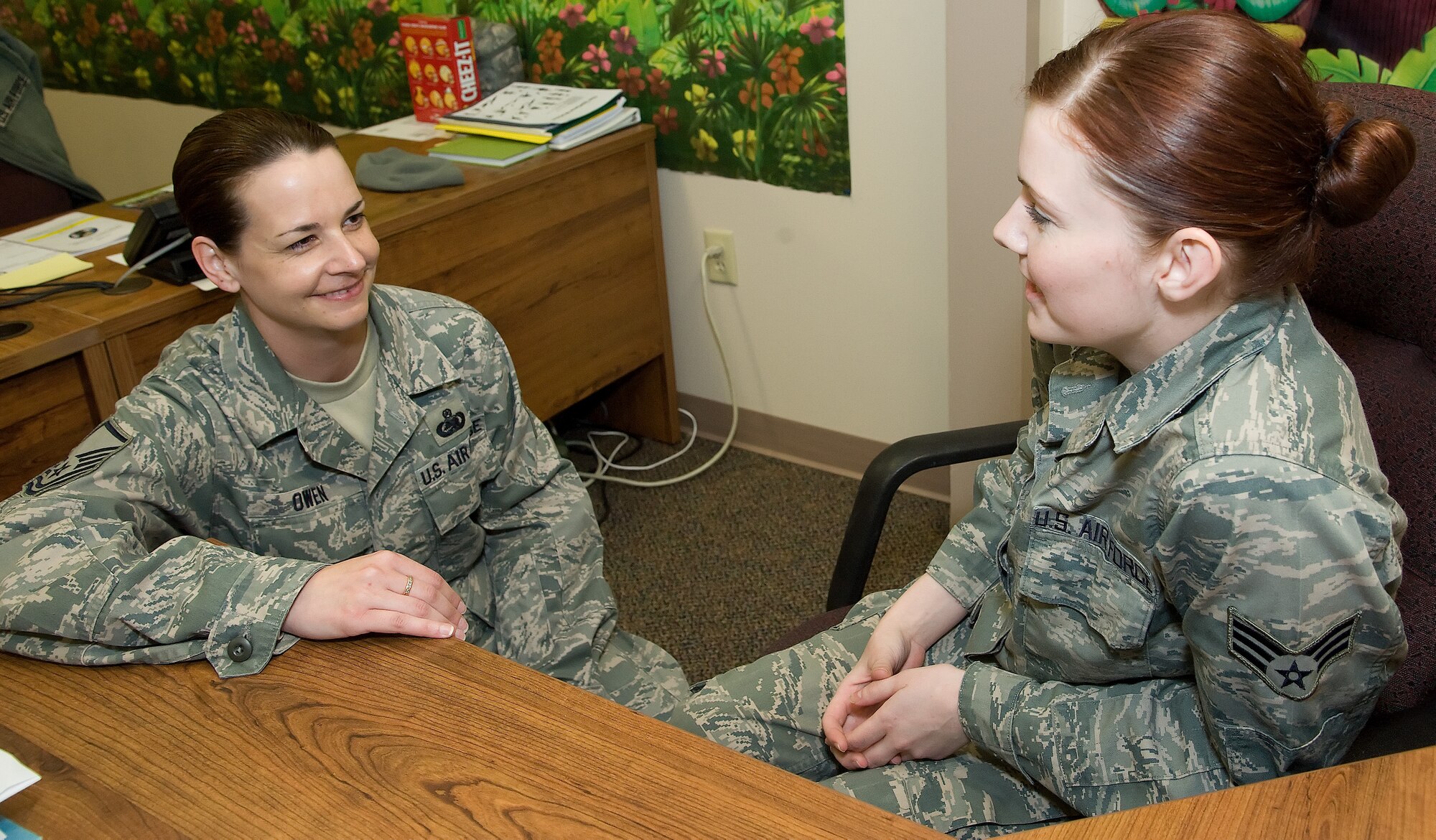 Master Sgt. Jennifer Owen talks with one of her airmen Dec. 2, 2011, Dover Air Force Base, Del.(U.S. Air Force photo by Adrian R. Rowan)

