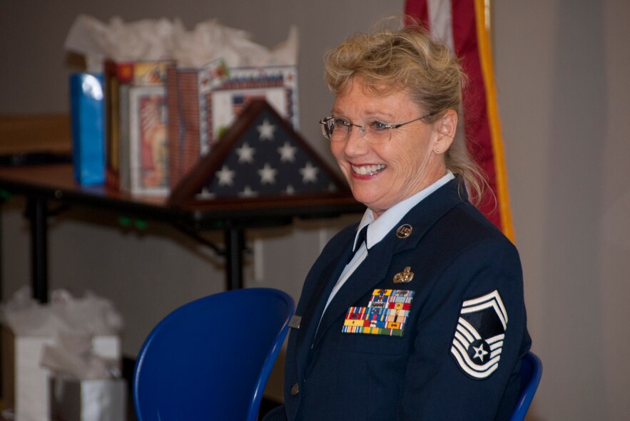Senior Master Sgt. Brenda Chase smiles at guests in attendance at her retirement ceremony Dec. 3. (U.S. Air Force photo/Master Sgt. Dave Dave Neve)