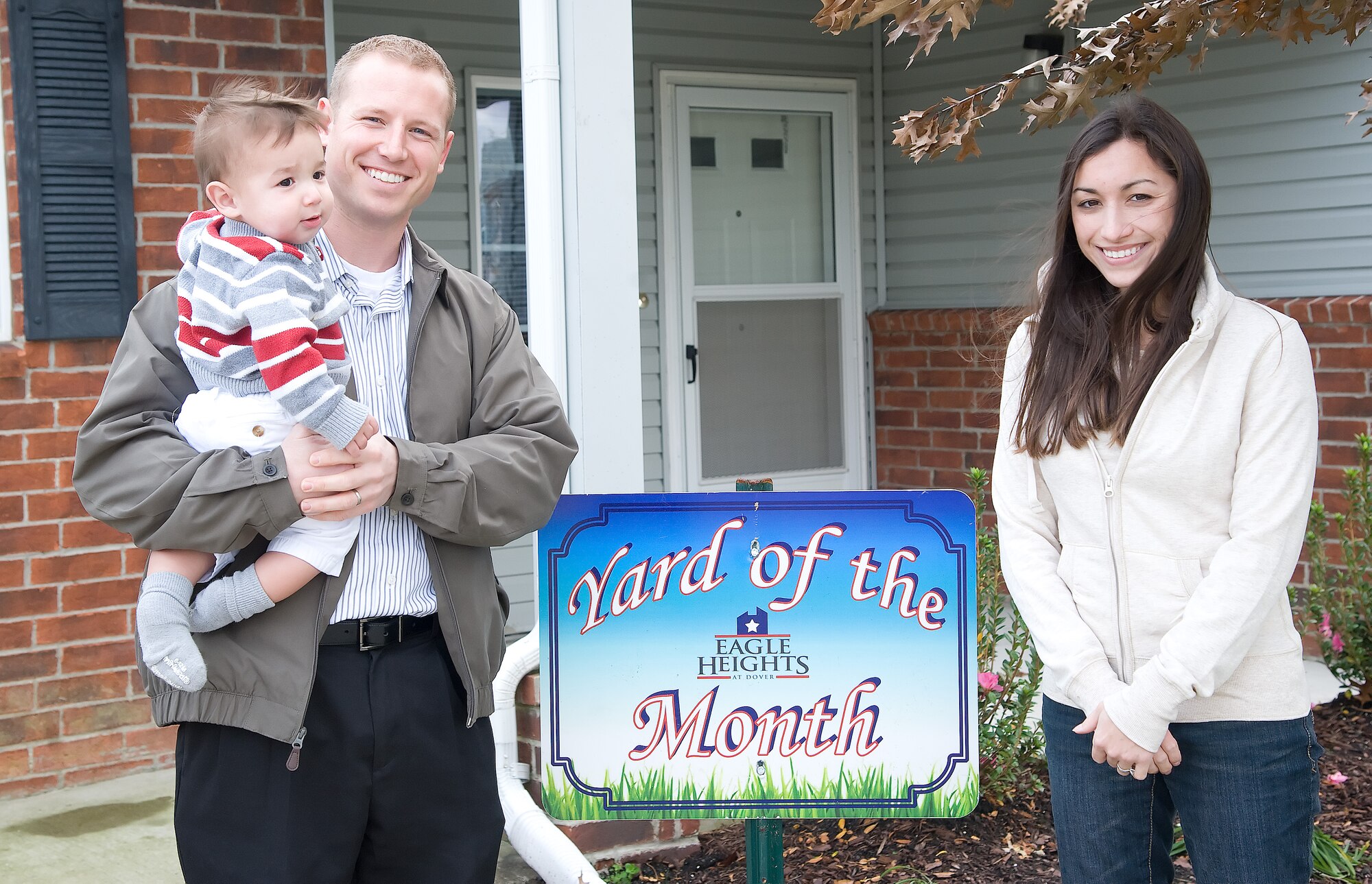 Right to left: Ashley, Justin and Joshua Downden were recognized as the Oriole’s Cove Yard of the Month winners for November at Dover Air Force Base, Del. (U.S. Air Force photo by Adrian Rowan)


