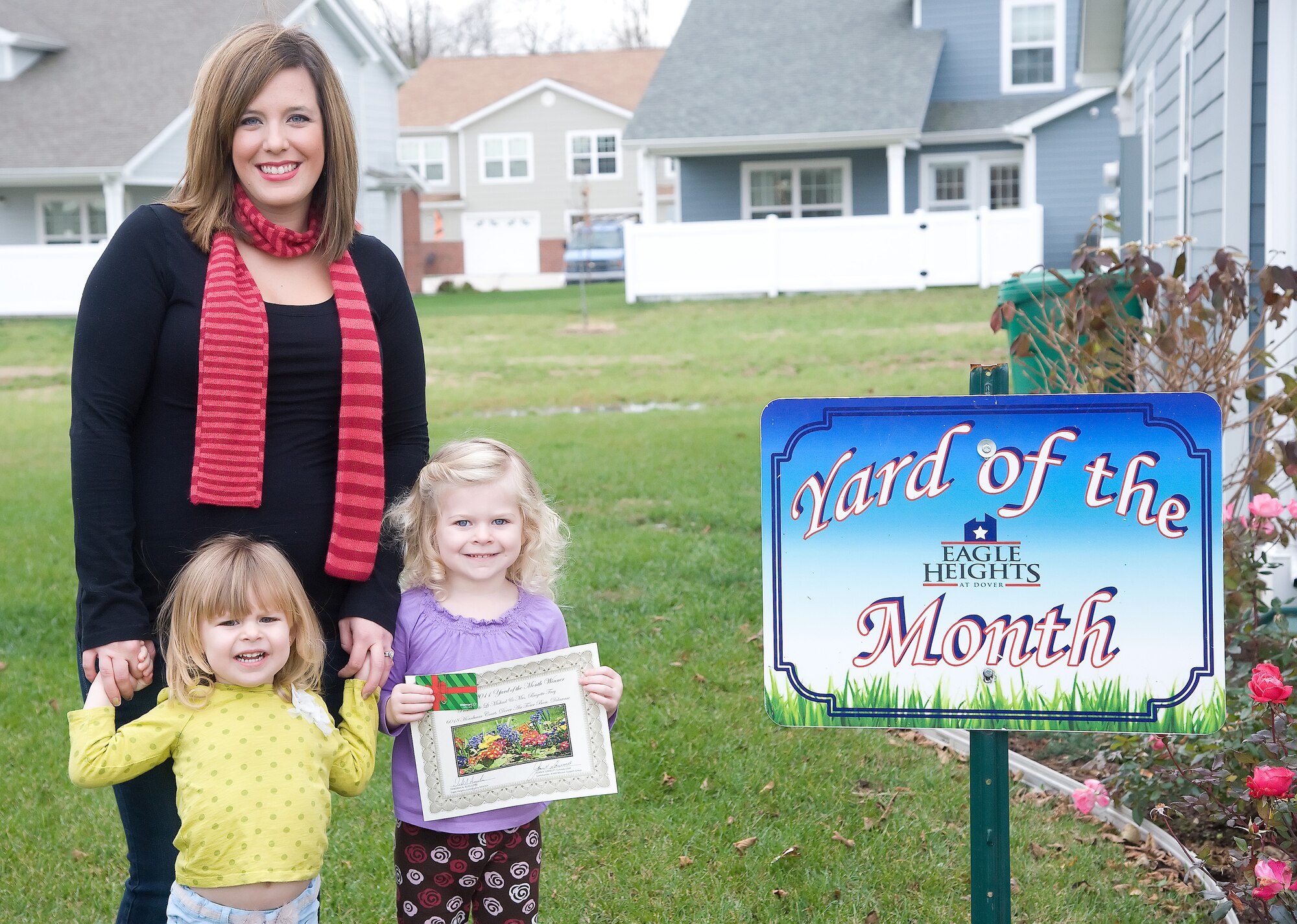 Brigette Frey, left, and her daughters, Elaina and Sophia, were recognized as the Falcon View Yard of the Month winners for November at Dover Air Force Base, Del. (U.S. Air Force photo by Adrian Rowan)


