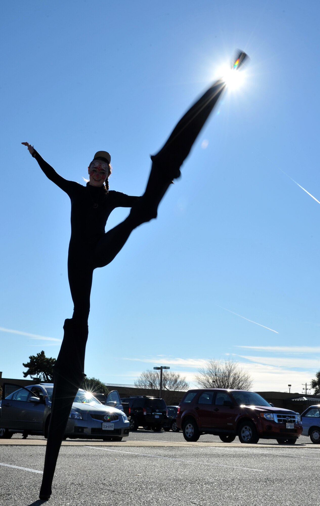 Britainy Dibbs, a Cirque du Soleil promotional performer, executes a high kick at Langley Air Force Base, Va., Dec. 2, 2011. Cirque du Soleil's Quidam is a thrilling combination of acrobatic artistry, technical expertise, extravagant design and exceptional musical numbers. (U.S. Air Force photo by Airman 1st Class Camilla Griffin/Released)