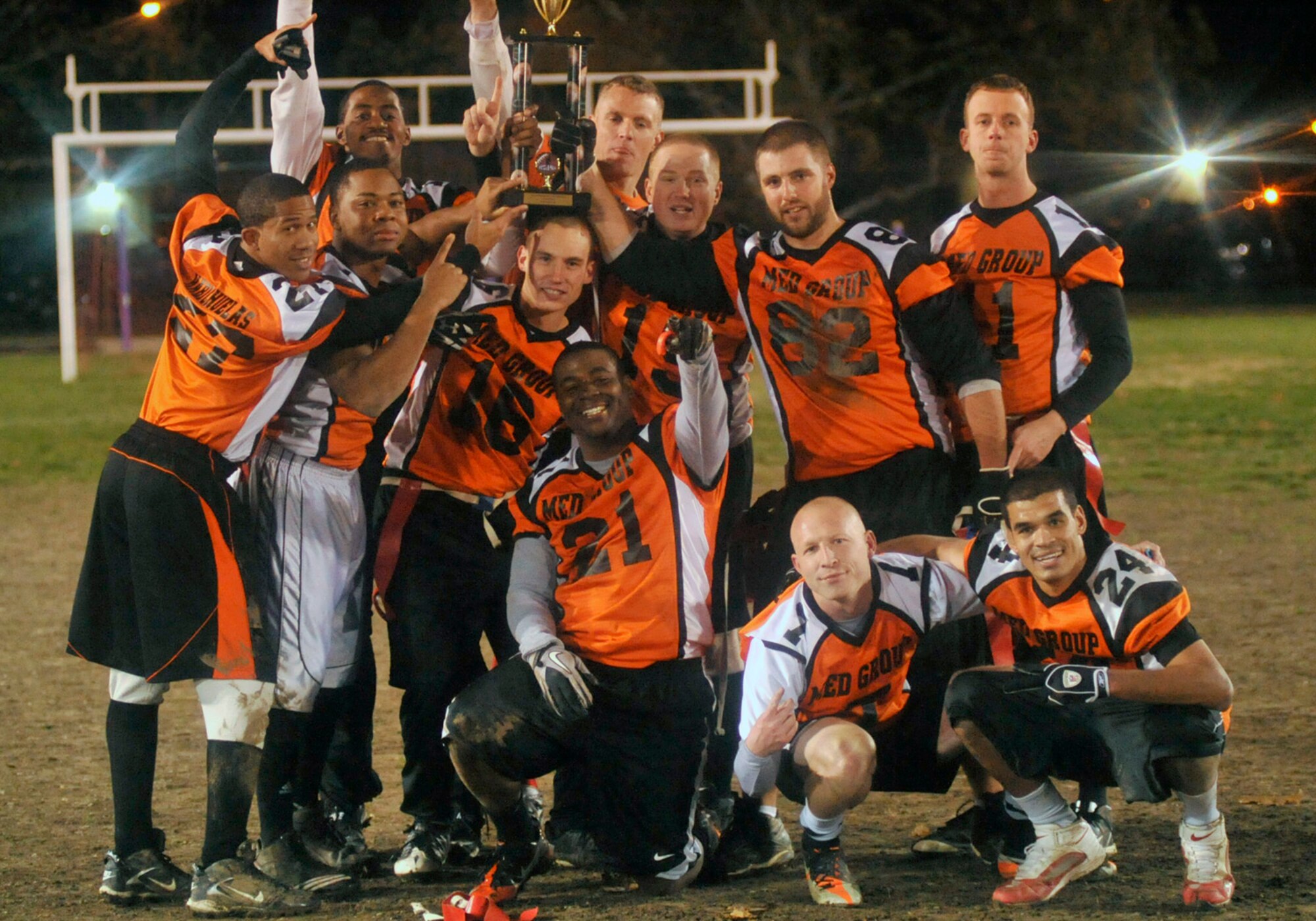 The 436th Medical Group holds high the championship trophy on Dec. 1, 2011 at Dover Air Force Base, Del. The Med Group defeated the 436 Civil Engineer Squadron 34-27 and 25-18 to take home the base championship. (U.S. Air Force photo by Tech. Sgt. Chuck Walker)