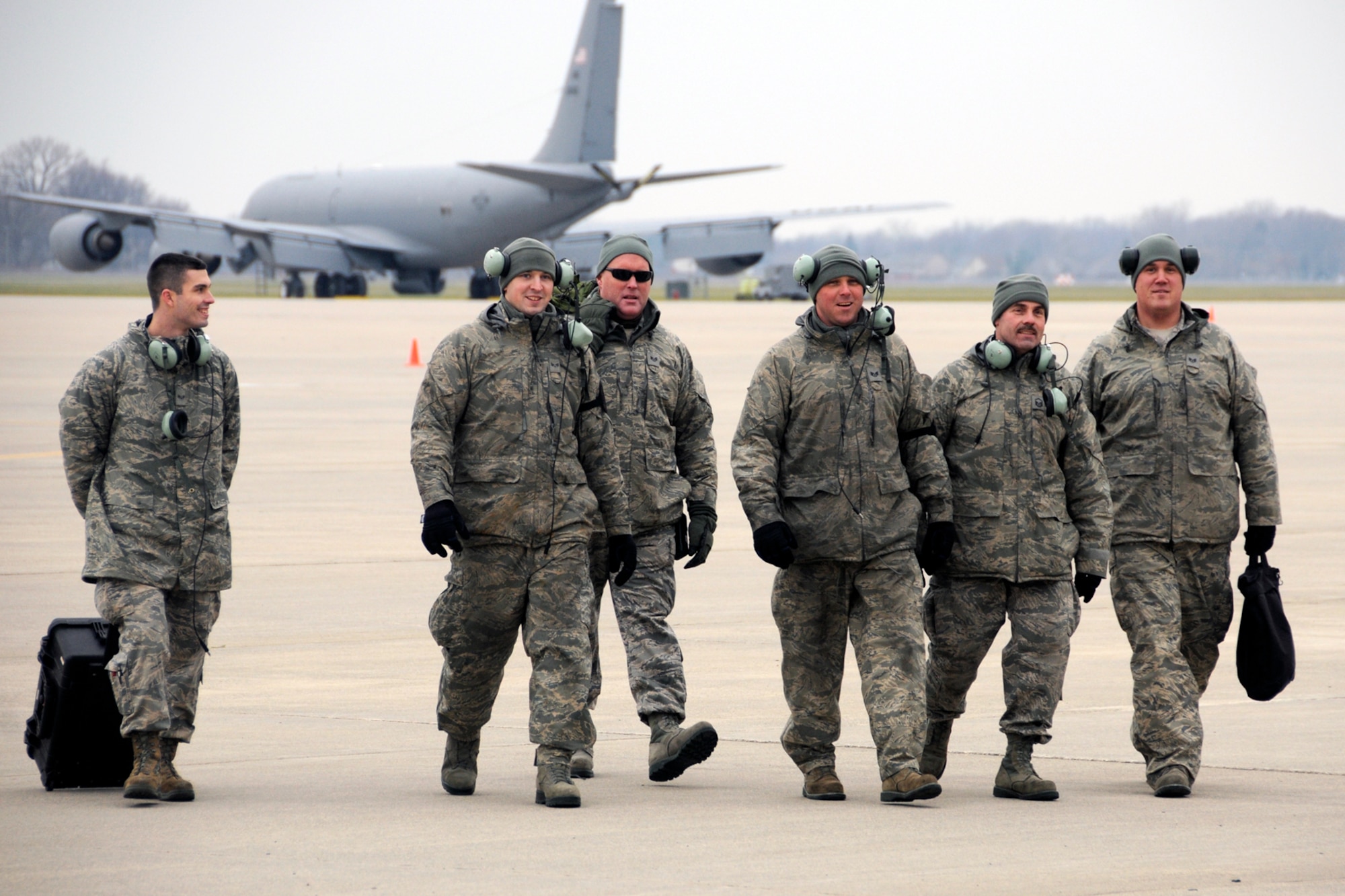 A group of crew chiefs from the 191st Aircraft Maintenance Squadron return to a maintenance hangar after preparing several KC-135 Stratotanker aircraft for take-off at Selfridge Air National Guard Base, Mich., Dec. 3, 2011. Crew chiefs perform and coordinate a wide variety of maintenance tasks and prepare the aircraft for flight. (U.S. Air Force photo by TSgt. David Kujawa)