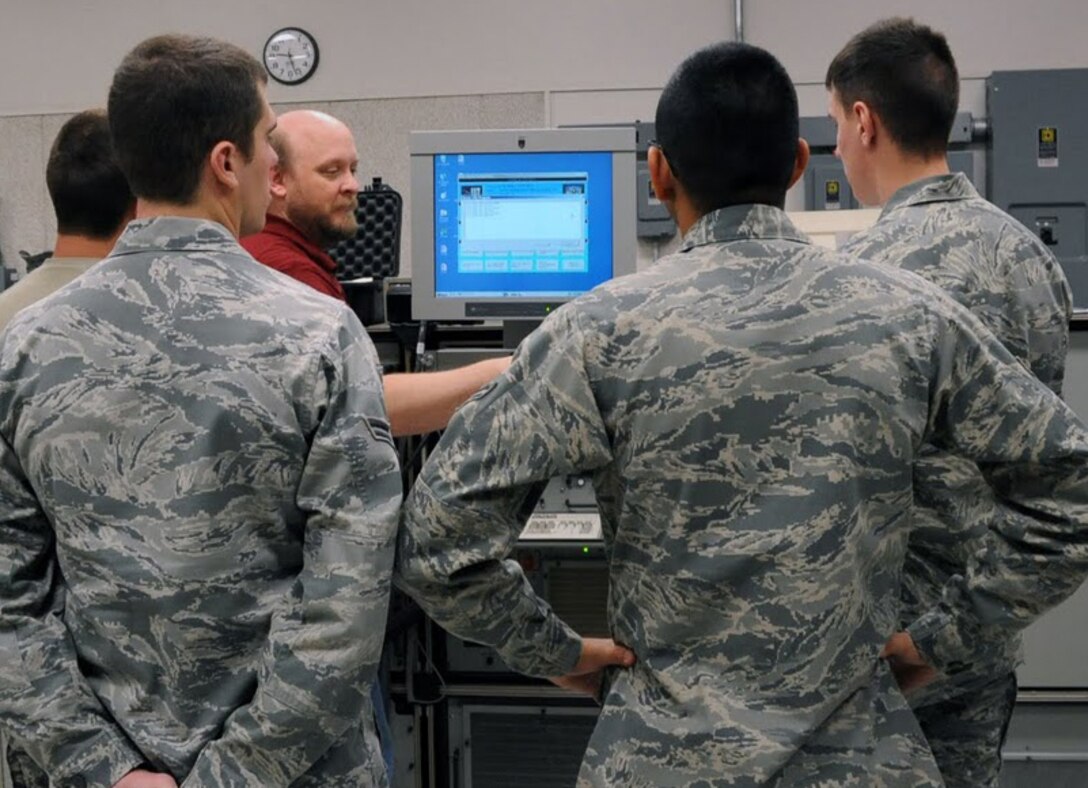 Students from the 365th Training Squadron at Sheppard AFB, Texas set up a training problem on a test station during technical training on Dec 1, 2011. The Airmen are in the Avionics Attack Control Systems apprentice course. (U.S. Air Force photo/Josh Wilson)