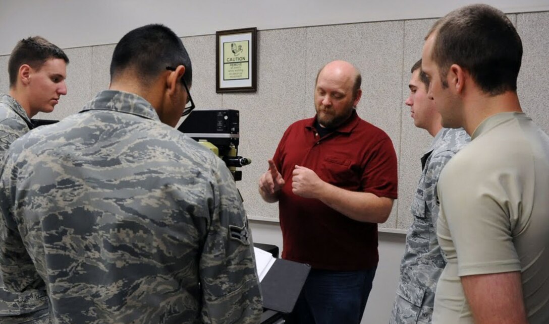 Students from the 365th Training Squadron at Sheppard AFB, Texas read a technical order during technical training on Dec 1, 2011. The Airmen are in the Avionics Attack Control Systems apprentice course. (U.S. Air Force photo/Josh Wilson)