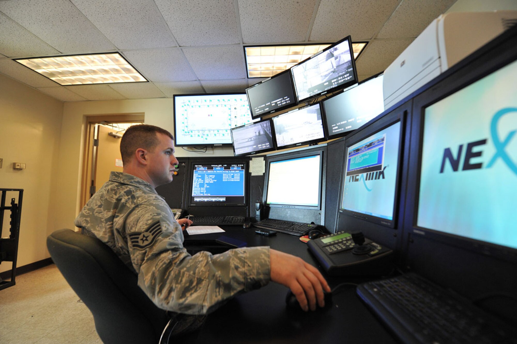 ROBINS AIR FORCE BASE, Ga. - Staff Sgt. Kyle Crook, 78th Security Forces Squadron, monitors the Command, Control and Display Equipment components of the Robins AFB Intrusion Detection System, a program recently completed by Electronic Systems Center's Force Protection Office. The operator can monitor all activity in the detection area and initiate a response force if needed.  (Courtesy Photo) 
