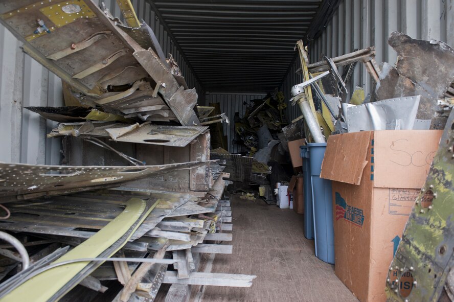 Broken and damaged XP-82 Twin Mustang parts sit in a storage unit in Douglas, Ga., Oct. 18, 2011. Tom Reilly, owner of the B-25 Group, traveled around the world collecting parts to begin work on a restoration project for the aircraft. (U.S. Air Force photo by Airman 1st Class Jarrod Grammel/Released)

