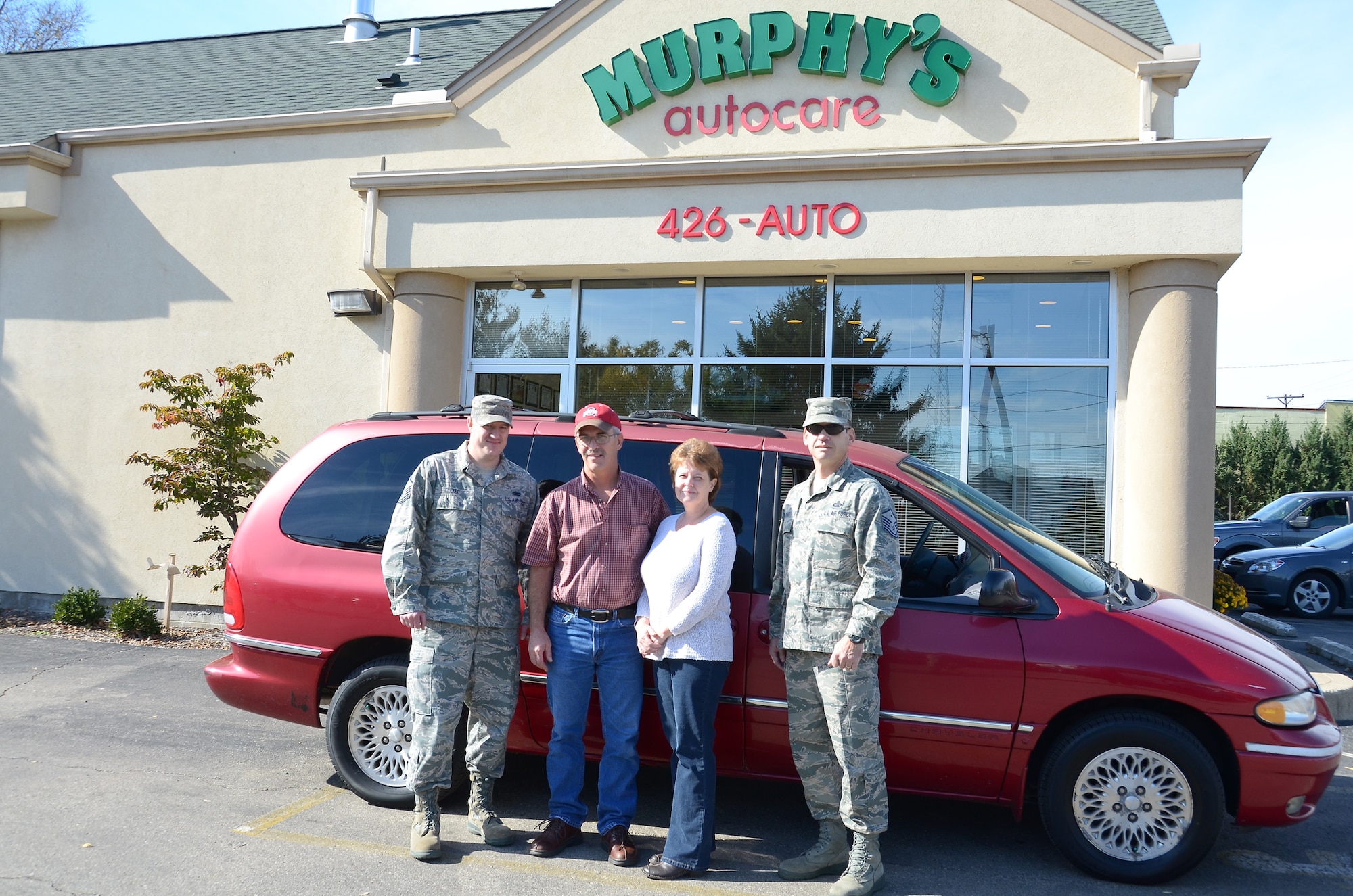 WRIGHT-PATTERSON AIR FORCE BASE, Ohio - Tech. Sgt. Robert Monti, 445th Maintenance Squadron machinist, and his wife, Sheri, enjoy their new vehicle presented to them Nov. 2 by Dave and Jan Murphy, owners of Murphy’s Autocare of Beavercreek, Ohio. Sharing their joy are Sergeant Monti's supervisor, Master Sgt.   Jason Cox (on the left) and Master Sgt. Anthony Johns, 445th Operations Support Squadron first sergeant. (U.S. Air Force photo/Lt. Col. Cynthia Harris)
