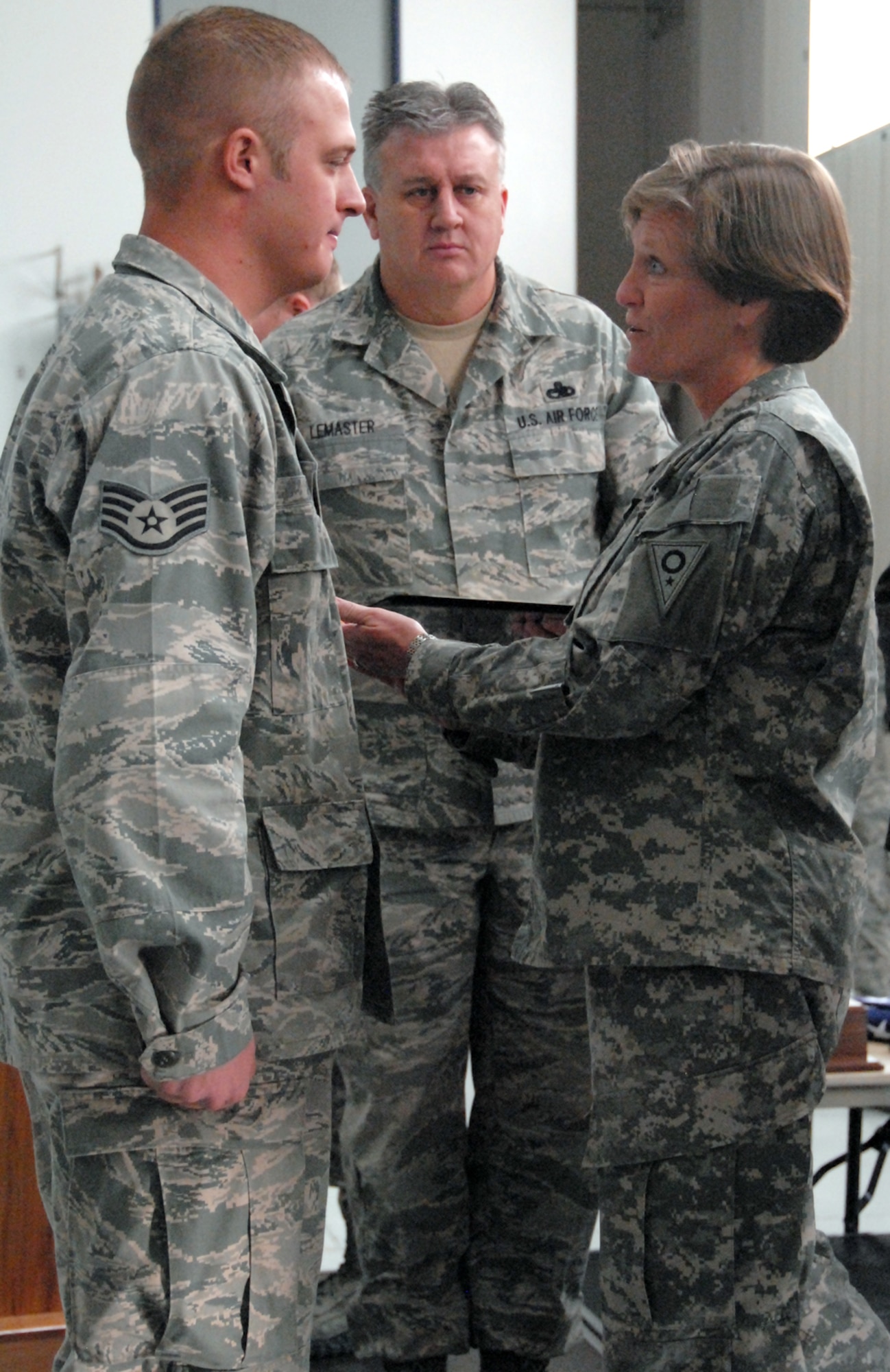 Staff Sgt. Tyler Ogden of the 178th Security Forces Squadron receives a Purple Heart from Maj. Gen. Deborah Ashenhurst, Ohio adjutant general, during a ceremony Dec. 3, 2011 at Springfield Air National Guard Base, Ohio.  As a member of the U.S. armed forces who has been “wounded by an instrument of war,” Ogden was awarded a Purple Heart. (U.S. Air Force Photo by MSgt. Seth Skidmore/Released)