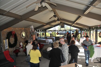 Members of Joint Base Charleston attend the Winter Wonderland grand opening Dec. 2 at Joint Base Charleston-Air Base. Winter Wonderland is a place where anyone can enjoy the wonders of lights, trees, toy trains, music, books and even a little Christmas magic. (U.S. Air Force photo/Airman 1st Class Jared Trimarchi) 