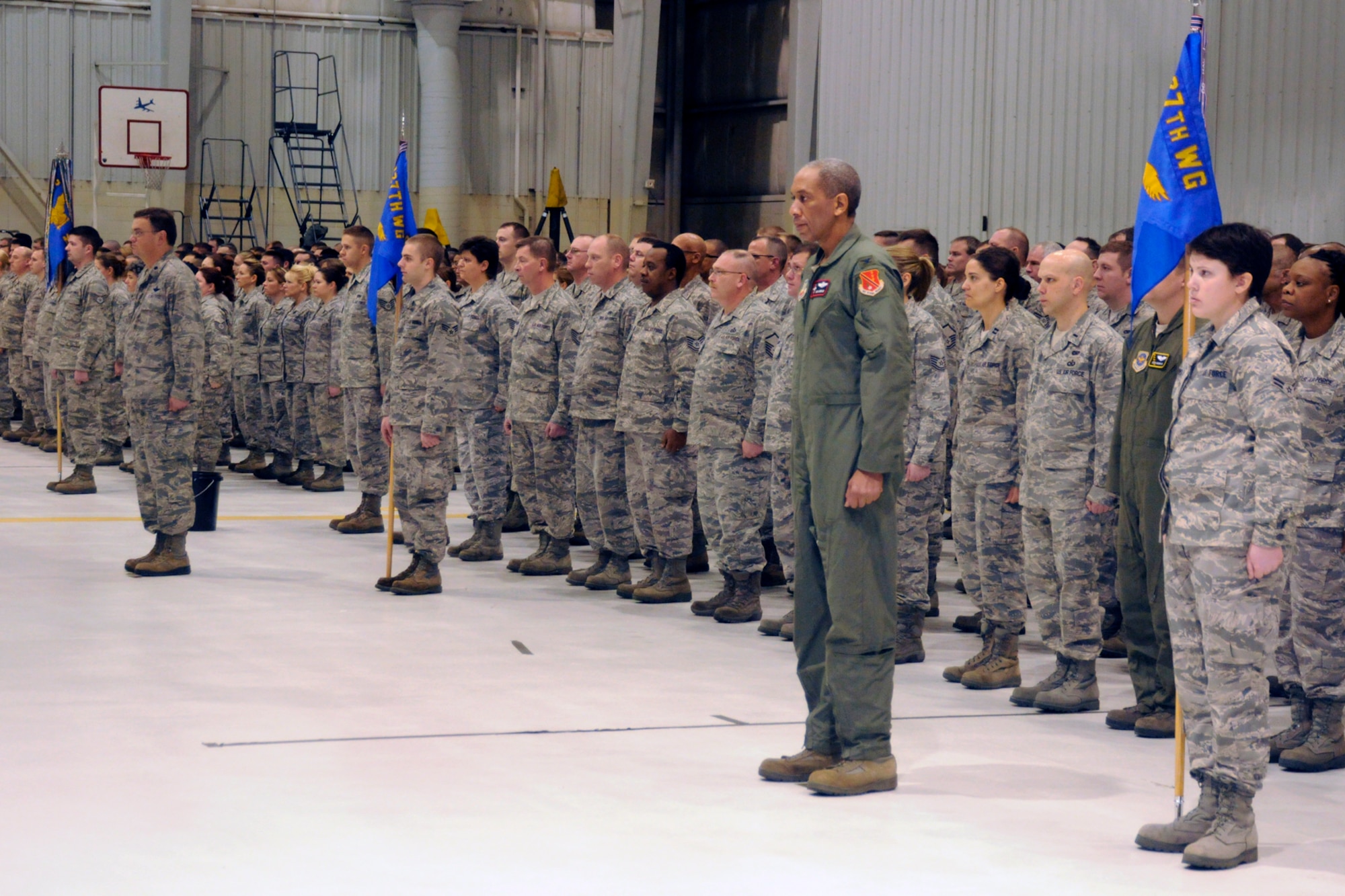 Airmen of the 127th Wing, Michigan Air National Guard, stand at attention during a commander's call and wing formation ceremony, Dec. 4, 2011, at Selfridge Air National Guard Base, Mich. The 127th Wing holds a formation near the end of the year to recognize outstanding achievements of its Airmen. (U.S. Air Force photo by TSgt. David Kujawa)