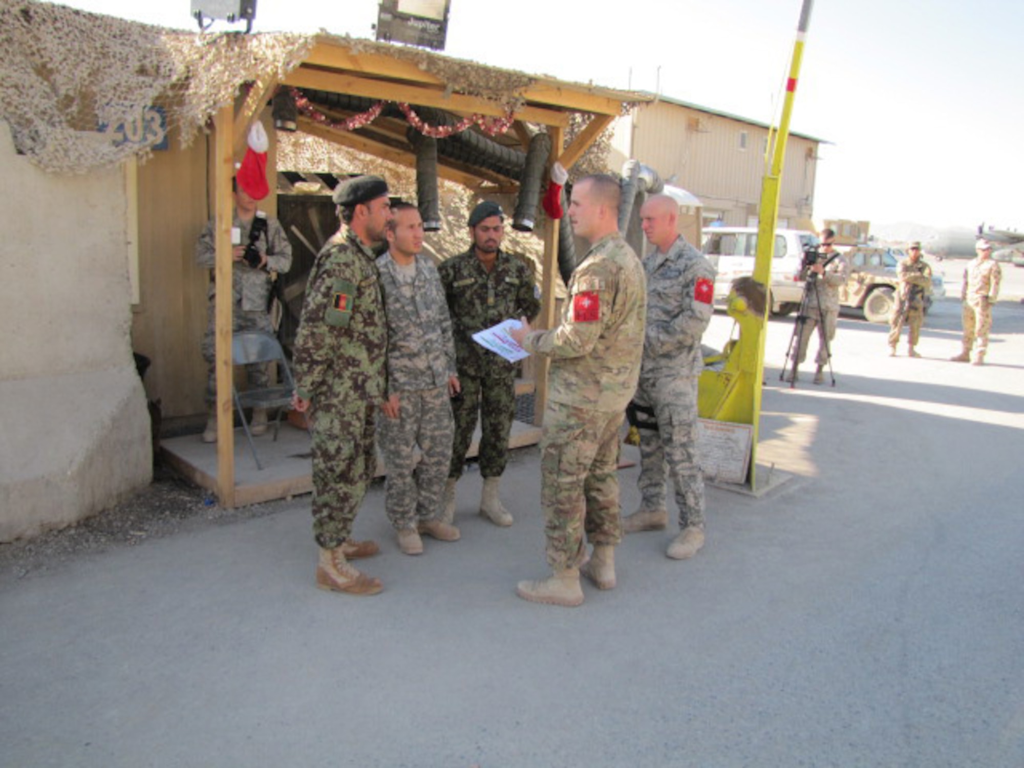 Afghan air force and U.S. Air Force security forces meet up to discuss a flightline security patrol. (courtesy photo)