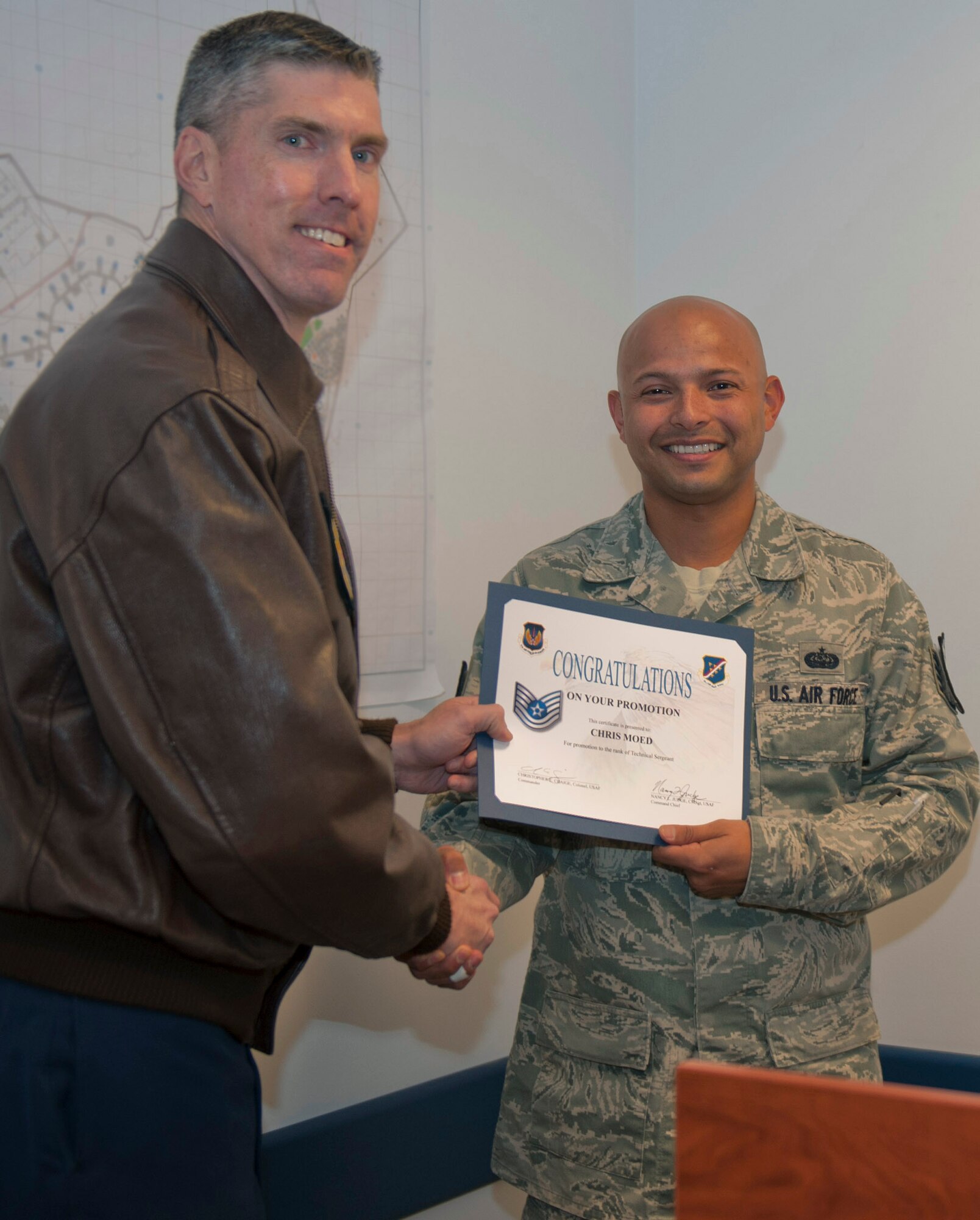 Staff Sgt. Chris Moed, 39th Communications Squadron radio frequency transmission systems supervisor, receives a certificate of promotion from Col. Chris Craige, 39th Air Base Wing commander, after being promoted through the Stripes for Exceptional Performers program Dec. 5, 2011, at Incirlik Air Base, Turkey. STEP is an incentive program that identifies outstanding senior airmen, staff sergeants and technical sergeants and is based on the Airman’s professional accomplishments and recommendations from their commander. (U.S Air Force Photo by Senior Airman Anthony Sanchelli/Released)