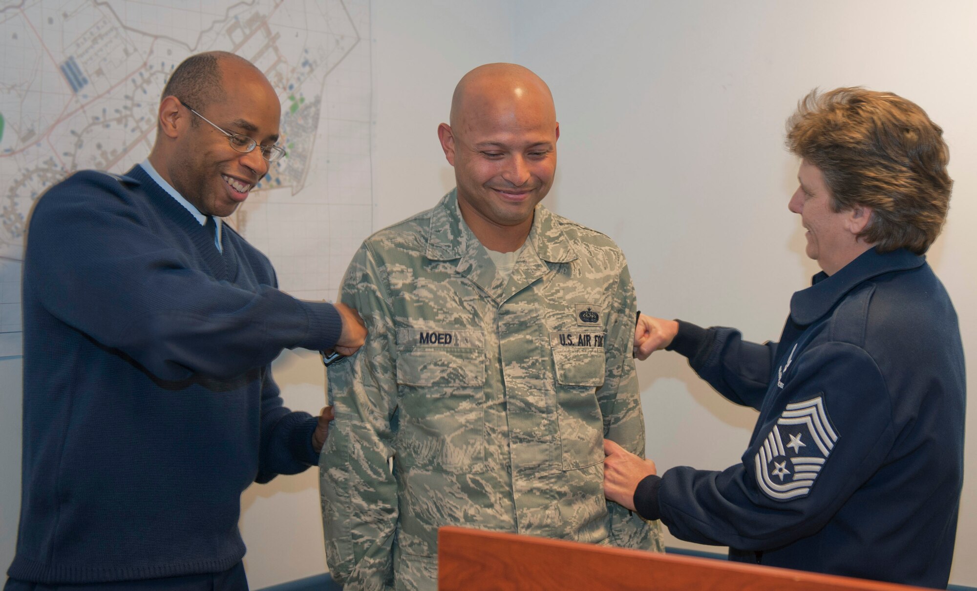 Staff Sgt. Chris Moed, 39th Communications Squadron radio frequency transmission systems supervisor, center, receives technical sergeant stripes from Lt. Col. Patrick Daniel, 39th CS commander, left, and Chief Master Sgt. Nancy Judge, 39th Air Base Wing command chief, after being promoted through the Stripes for Exceptional Performers program Dec. 5, 2011, at Incirlik Air Base, Turkey. STEP is an incentive program that identifies outstanding senior airmen, staff sergeants and technical sergeants and is based on the Airman’s professional accomplishments and recommendations from their commander. (U.S Air Force Photo by Senior Airman Anthony Sanchelli/Released)