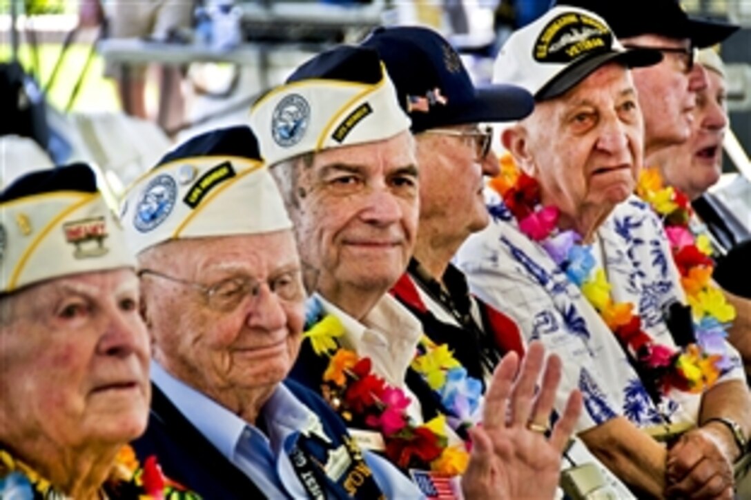 Pearl Harbor survivors observe the U.S. Naval Sea Cadets Concert Band of the West perform at the Pearl Harbor Memorial Museum & Visitor Center during Kama'aina and military appreciation day at Pearl Harbor, Hawaii, Dec. 4, 2011. This year marks the 70th anniversary of the 1941 attacks on Pearl Harbor in which more than 2,400 people died.