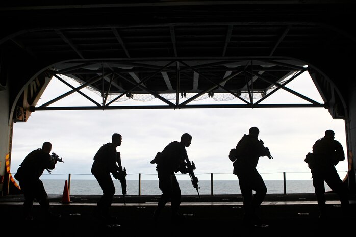 Marines with Bravo Company, Battalion Landing Team 1st Battalion, 2nd Marine Regiment, 24th Marine Expeditionary Unit conduct rifle movement drills during sustainment training aboard the USS Iwo Jima (LHD 7) Dec. 6, 2011. The 24th MEU is currently taking part in Composite Training Unit Exercise (COMPTUEX), scheduled to take place Nov. 28 to Dec. 21. The training is meant to develop cohesion between the 24th MEU and Amphibious Squadron 8 (PHIBRON 8) in conducting amphibious operations, crisis response, and limited contingency operations while operating from the sea.