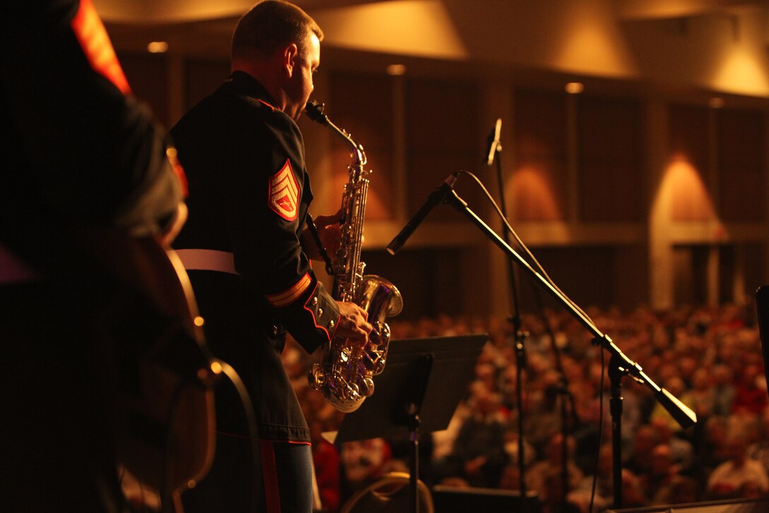 Staff Sgt. Jacob Furlong, saxophone player, Combat Center Band, leads a small ensemble in playing a holiday tune during their annual Holiday Concert at the Palm Springs Convention Center Dec. 7, 2011.