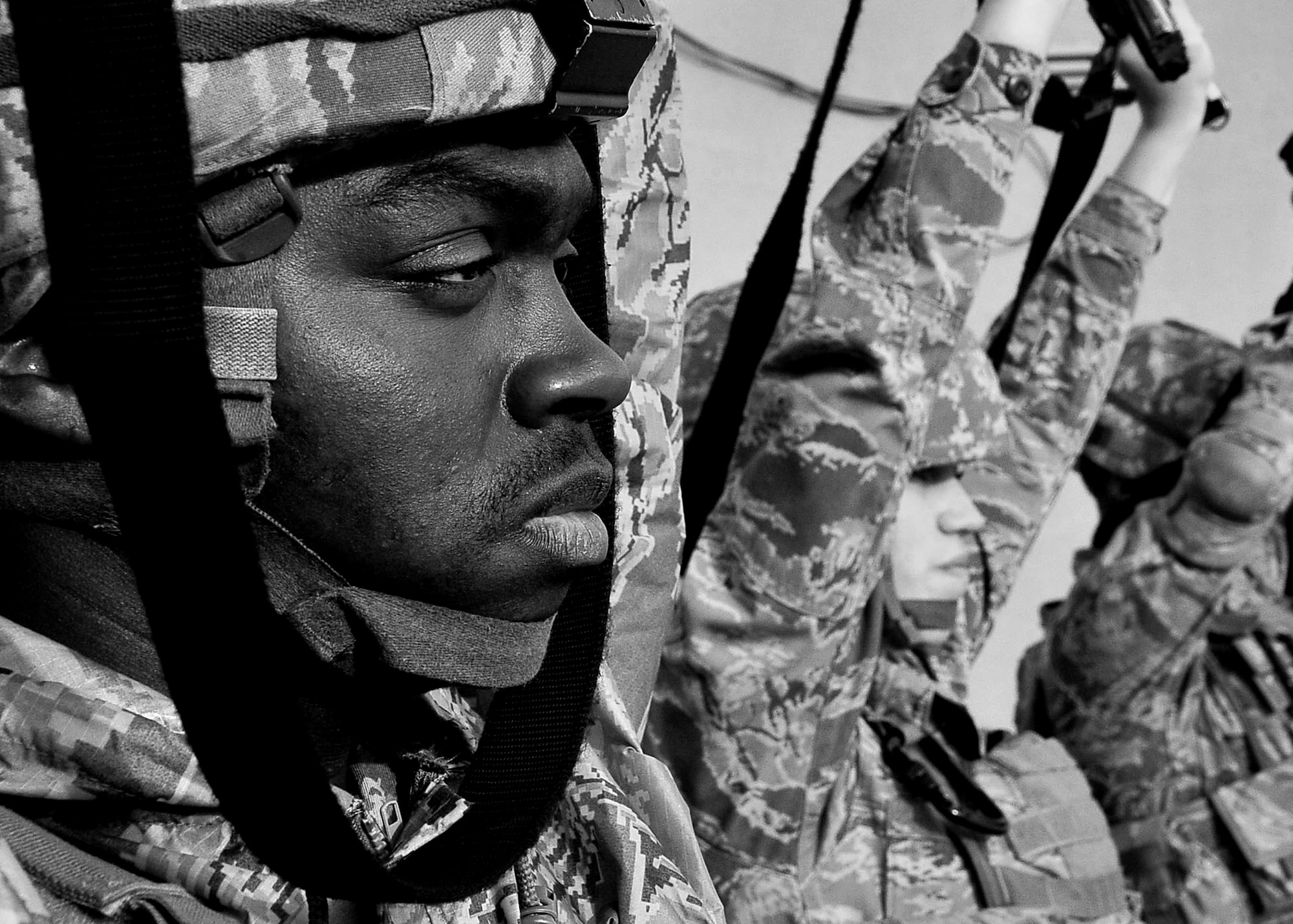 Staff Sgt. Maurice Williams, 51st Security Forces Squadron member, holds his weapon above his head and awaits orders during the confidence course portion of the Combat Readiness Course Dec. 05, 2011. The confidence course is aimed to test participants both physically and mentally with the overall goal of ensuring their prepared to defend Osan Air Base at a moment’s notice. (U.S. Air Force photo/Senior Airman Adam Grant)