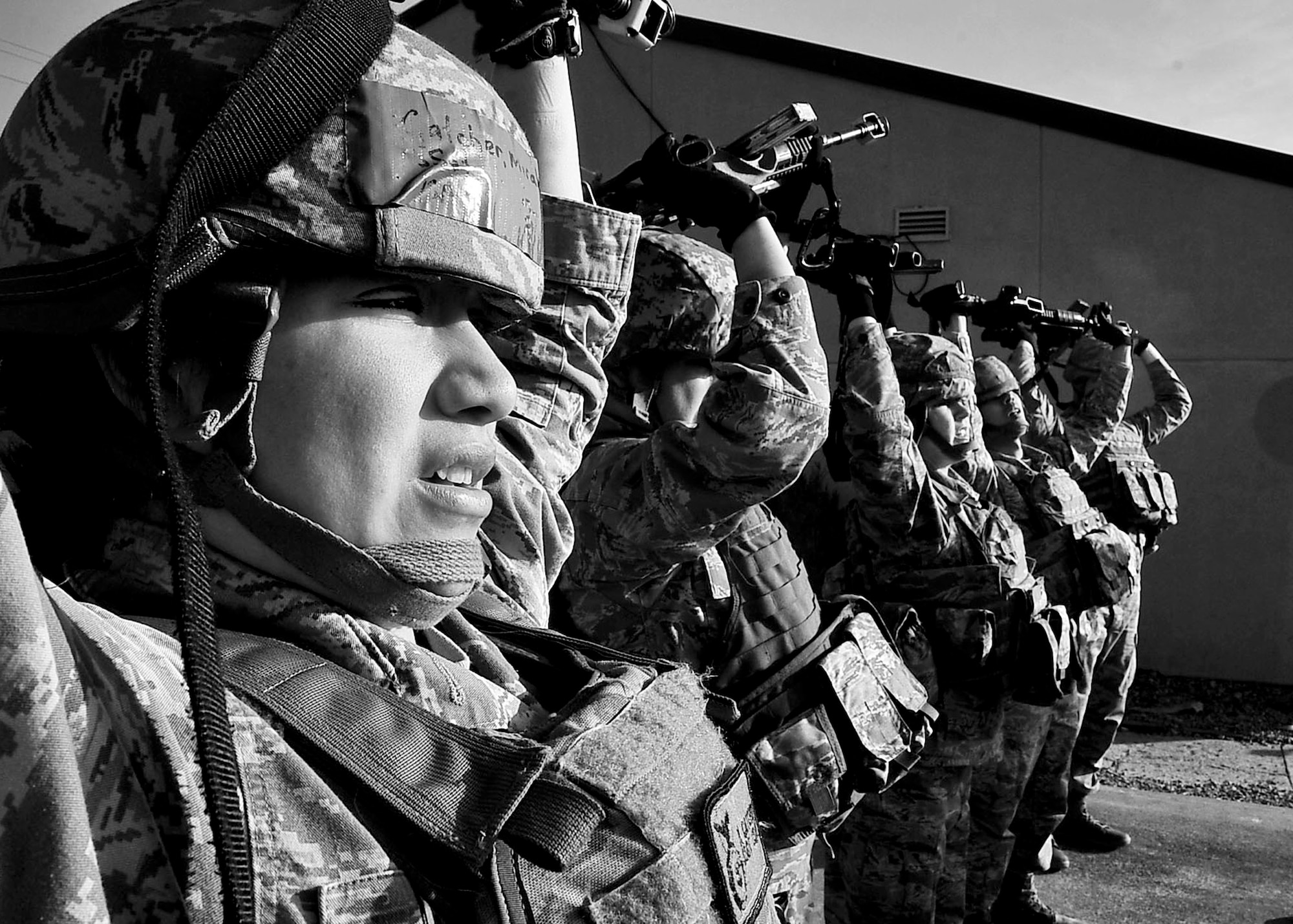 Staff Sgt. Miranda Catcher, 51st Security Forces Squadron combat readiness instructor, awaits instructions during the confidence course portion of the Combat Readiness Course Dec. 05, 2011. The Combat Readiness Course happens once a month and is offered to all new security forces members. (U.S. Air Force photo/Senior Airman Adam Grant)