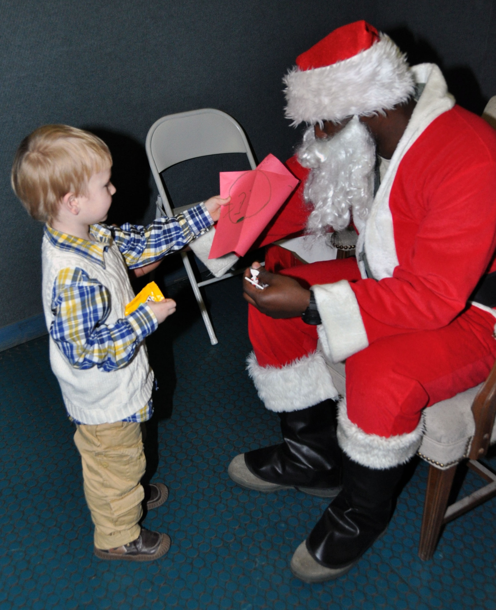 Children from Team Osan were given a chance to give Christmas wish lists to Santa Clause during the base tree lighting ceremony Dec. 7, 2011. Approximately 400 members of Team Osan enjoyed music, caroling and a chance to meet Santa Clause. (U.S. Air Force photo/Airman 1st Class Michael Battles)