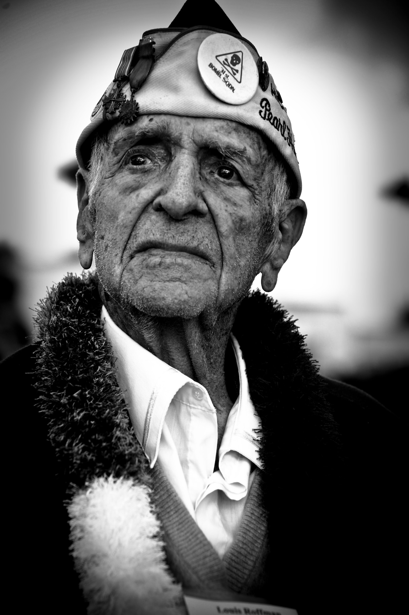 Former Tech. Sgt. Lou Roffman attends the 70th Anniversary Remembrance Ceremony of the attacks on Hickam Field, now Joint Base Pearl Harbor-Hickam, Hawaii, Dec. 7, 2011. Roffman was asleep when the Japanese attacked, like many, he thought it was the Navy practicing and wasn't alarmed until he heard explosions. Roffman took action and under the direction of a World War I combat veteran, began to move the B-17s off the flightline. The aircraft he was directed to move was hit when a Japanese Val Dive Bomber approach and strafed an engine and the propeller. Roffman flew as part of a search crew looking for the Japanese the following day. (U.S. Air Force photo/Senior Airman Lauren Main)
