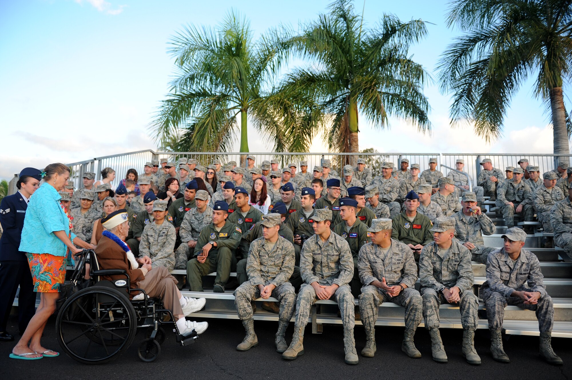 Former Tech. Sgt. Lou Roffman tells a joke to Hickam Airmen before the 70th Anniversary Remembrance Ceremony of the attacks on Hickam Field, now Joint Base Pearl Harbor-Hickam, Hawaii, Dec. 7, 2011. A Japanese bomber thwarted his attempts to save an undamaged B-17 on the flightline, hitting an engine and propeller. (U.S. Air Force photo/Staff Sgt. Mike Meares)