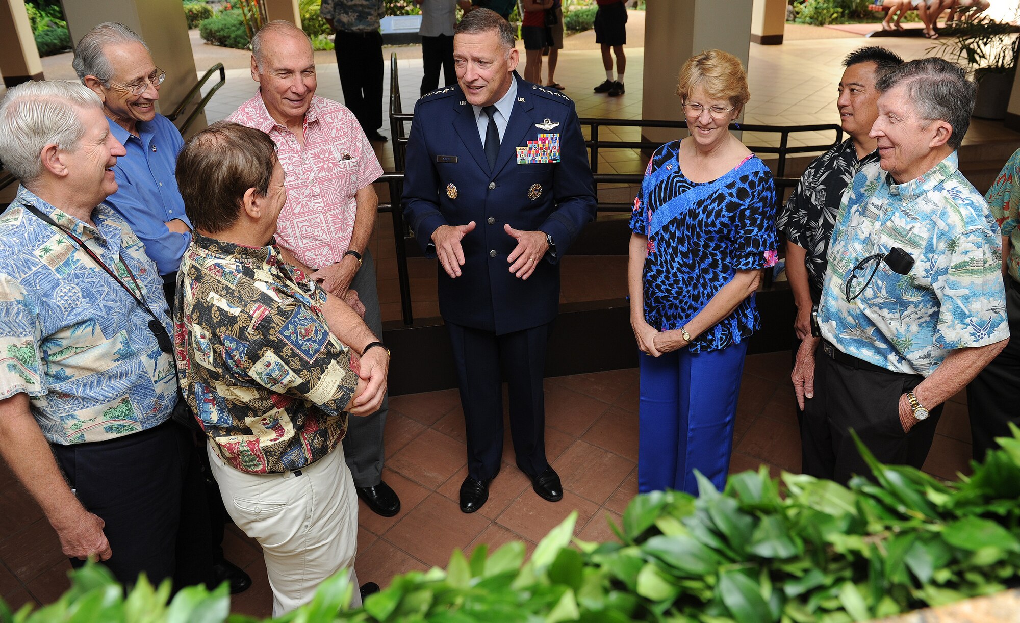 Gen. Gary North, Pacific Air Forces commander, talks with Pacific Air Forces Civilian Advisory Council members in front of a newly unveiled plaque in the Courtyard of Heroes, Pacific Air Forces Headquarters building, Joint Base Pearl Harbor-Hickam, Hawaii, Dec. 7, 2011 – a day marking the 70th anniversary of the 1941 attacks on Oahu. The plaque memorializes the 238 Army and Army Air Forces service members and civilians killed in those attacks.  (U.S. Air Force photo/Tech. Sgt. Jerome S. Tayborn/Released)