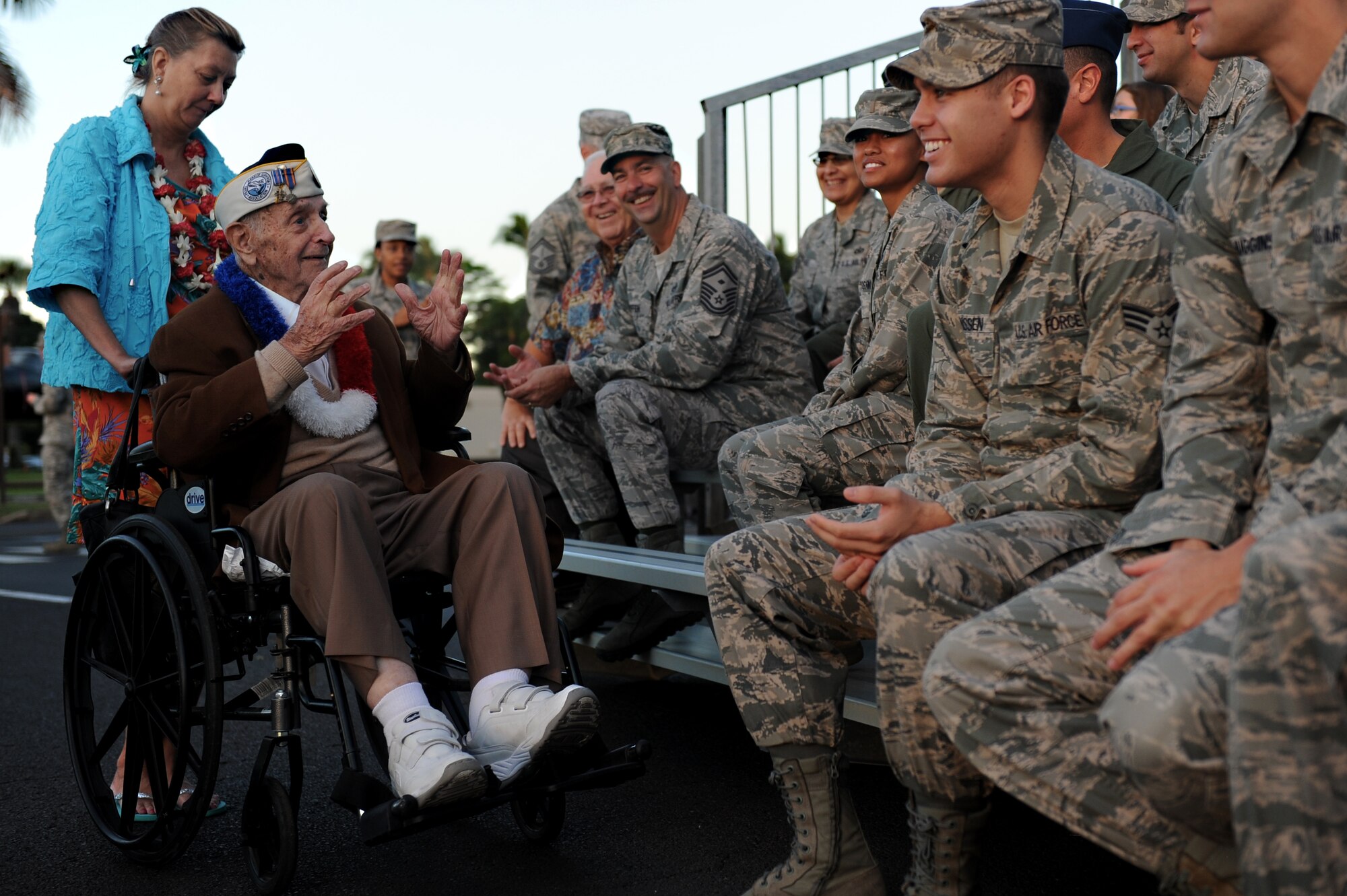 Former Tech. Sgt. Lou Roffman speaks with Hickam Airmen before the 70th Anniversary Remembrance Ceremony of the attacks on Hickam Field, now Joint Base Pearl Harbor-Hickam, Hawaii, Dec. 7, 2011. Roffman had a little too much to drink the night before and was was asleep when the Japanese attacked. (U.S. Air Force photo/Staff Sgt. Mike Meares)
