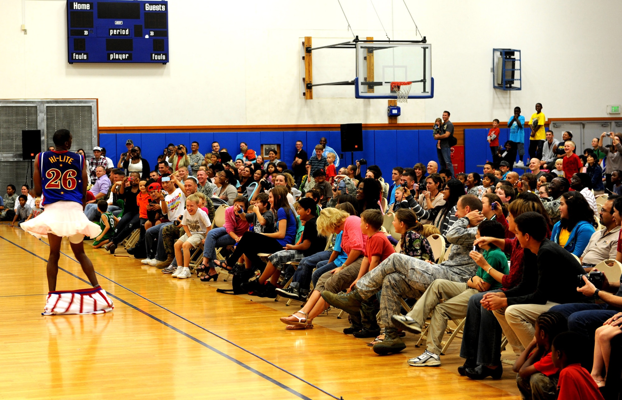 Hi-Lite, of the world-famous Harlem Globetrotters, strikes a pose during the basketball game at the Risner gymnasium on Kadena Air Base, Japan, Dec. 6, 2011. Hi-Lite is the captain of the Harlem Globetrotters as well as the most well-known. (U.S. Air Force photo by Airman 1st Class Justin Veazie/Released)