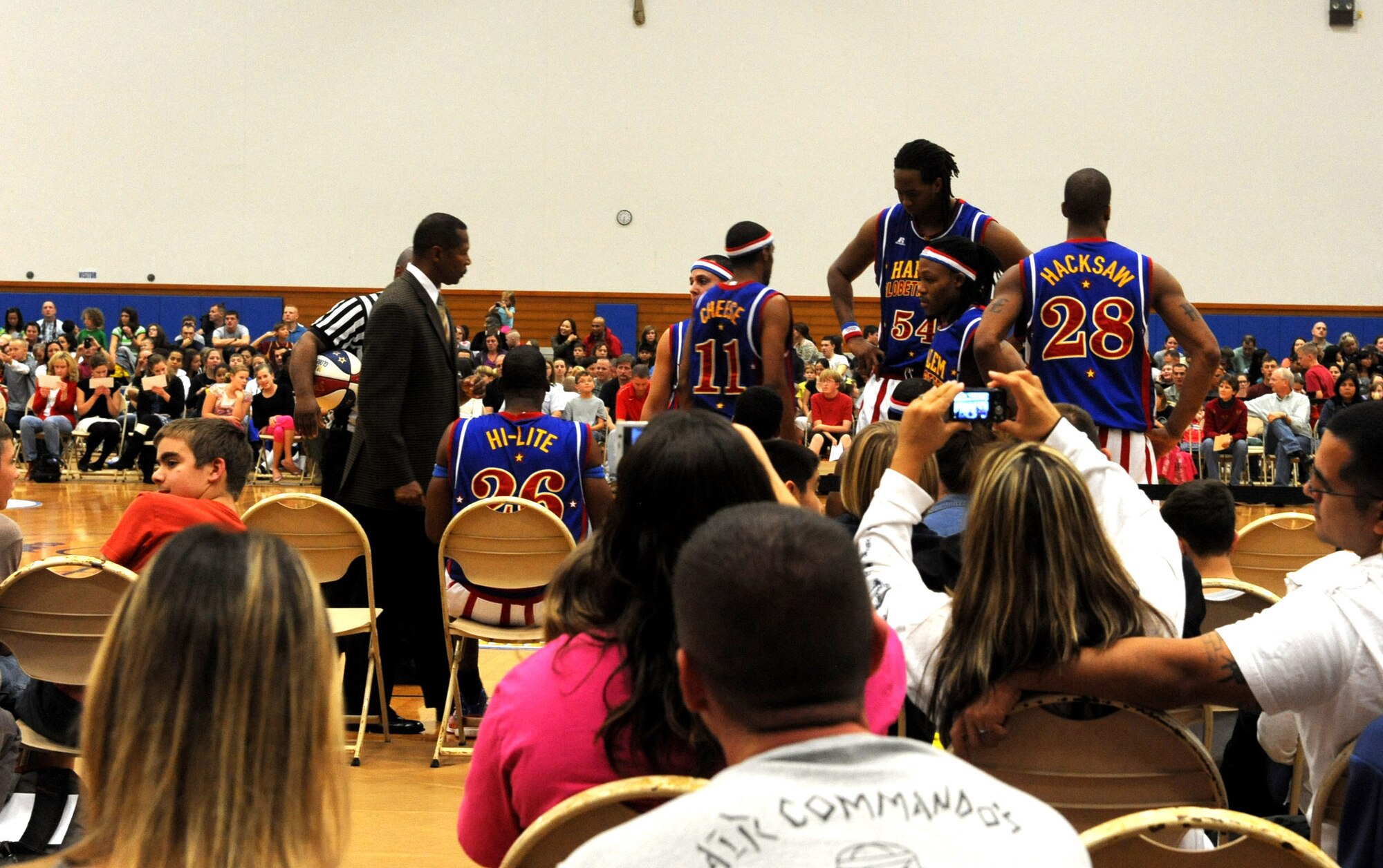 The Harlem Globetrotters strategize their game plan for the upcoming half during their basketball game at the Risner Gymnasium on Kadena Air Base, Japan, Dec. 5, 2011. The Harlem Globetrotters began in 1926 as the Savoy Big Five. Now, more than 85 years and 20,000 games later, the team has become one of the most recognizable franchises in sports. (U.S. Air Force photo by Airman 1st Class Justin Veazie/Released)