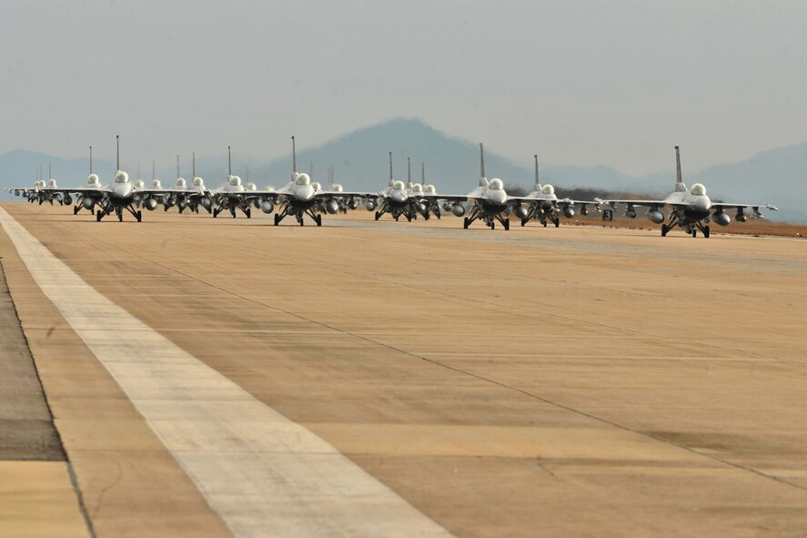 F-16 Fighting Falcons from both the 35th and 80th Fighter Squadrons of the 8th Fighter Wing, as well as from the 466th Fighter Squadron of the 419th Fighter Wing at Hill Air Force Base, Utah, demonstrate an elephant walk formation as they taxi down a runway during an exercise at Kunsan Air Base, Republic of Korea Dec. 2, 2011. The exercise showcased Kunsan AB aircrews' capability to quickly and safely prepare an aircraft for a wartime mission.  (U.S. Air Force photo by Senior Airman Brittany Y. Auld/Released)