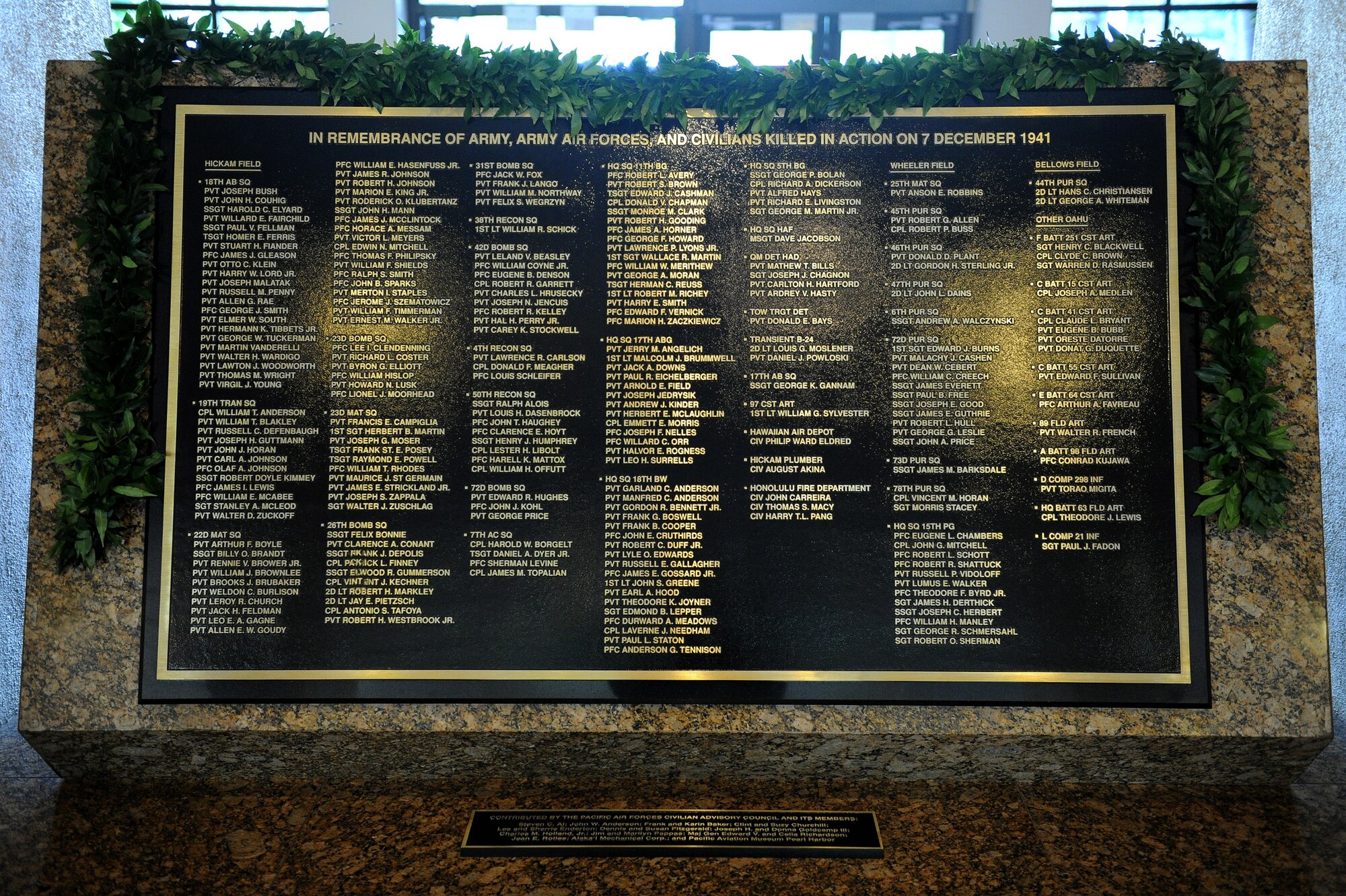 A newly unveiled plaque in the Courtyard of Heroes, Pacific Air Forces Headquarters building, Joint Base Pearl Harbor-Hickam, Hawaii, Dec. 7, 2011 –  a day marking the 70th anniversary of the 1941 attacks on Oahu. The plaque memorializes the 238 Army and Army Air Forces service members and civilians killed in those attacks.  (U.S. Air Force photo/Tech. Sgt. Jerome S. Tayborn/Released)