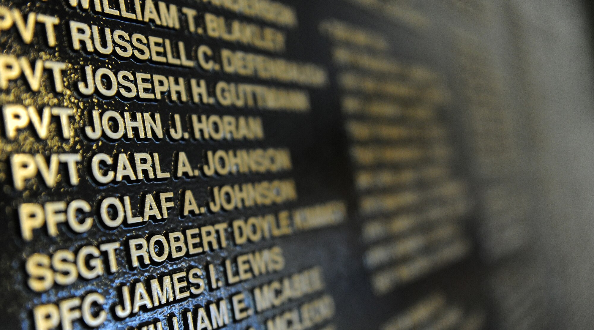 A newly unveiled plaque in the Courtyard of Heroes, Pacific Air Forces Headquarters building, Joint Base Pearl Harbor-Hickam, Hawaii, Dec. 7, 2011 –  a day marking the 70th anniversary of the 1941 attacks on Oahu. The plaque memorializes the 238 Army and Army Air Forces service members and civilians killed in those attacks.  (U.S. Air Force photo/Tech. Sgt. Jerome S. Tayborn/Released)