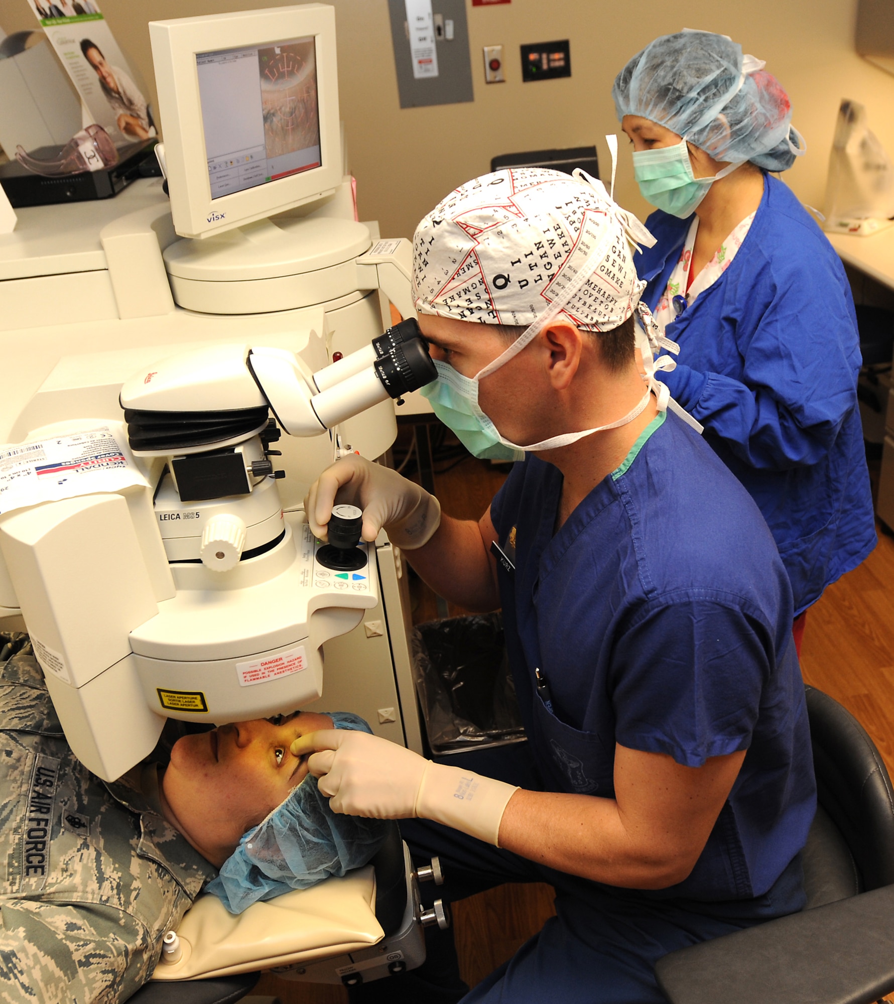 Dr. Christopher Kurz, a cornea and refractive surgeon, demonstrates the capabilities of the refractive surgery VISX Star S4 laser at David Grant USAF Medical Center, Dec. 7. (U.S. Air Force photo/Staff Sgt. Liliana Moreno)