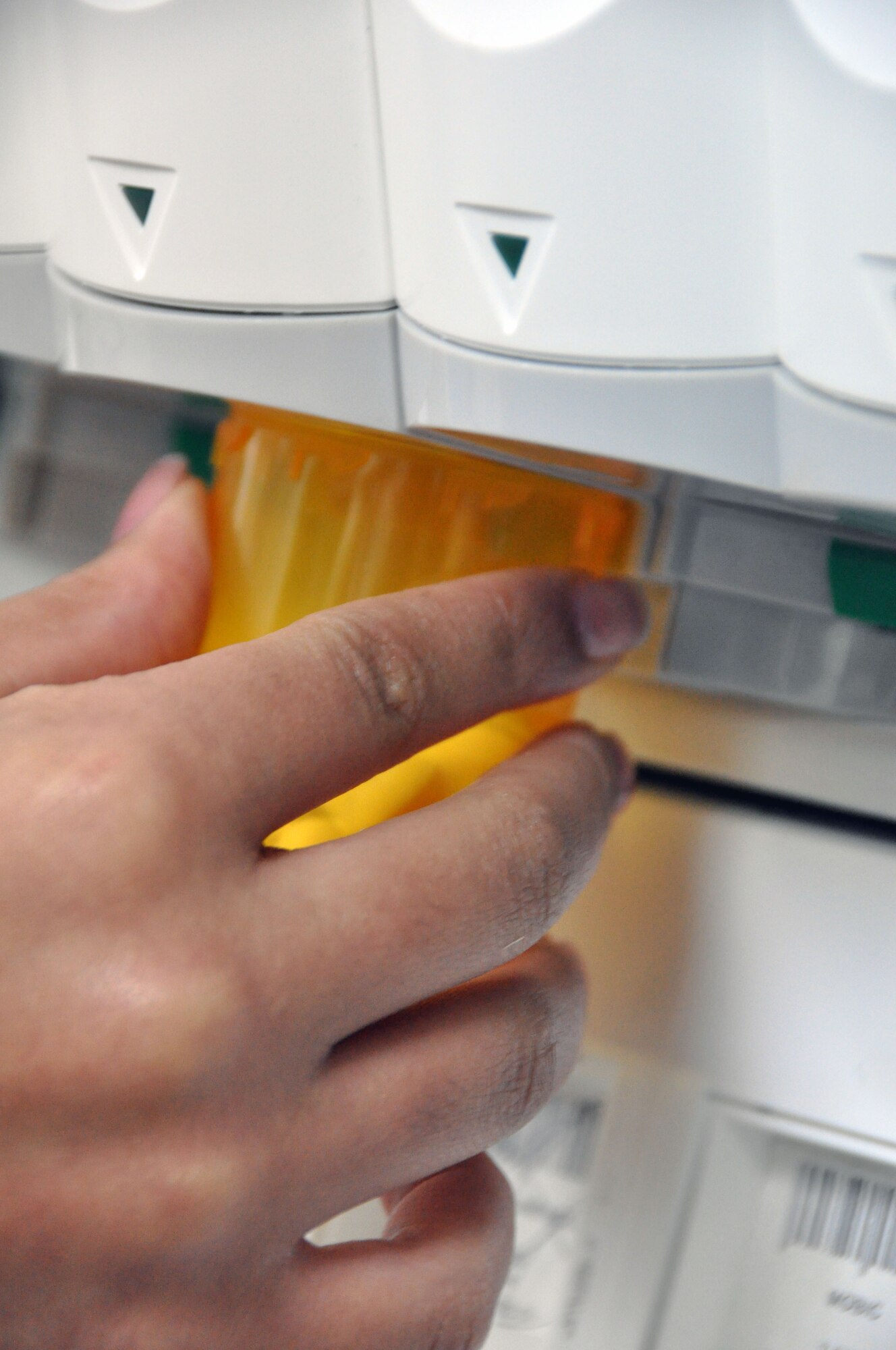 Pharmacy technicians use the pharmaccist automatic dispenser to refill many of their perscription orders throughout the week. The 51st Medical Group pharmacy processes nearly 100 Self Initiated Care Kits every month. (U.S. Air Force photo/Airman 1st Class Michael Battles)