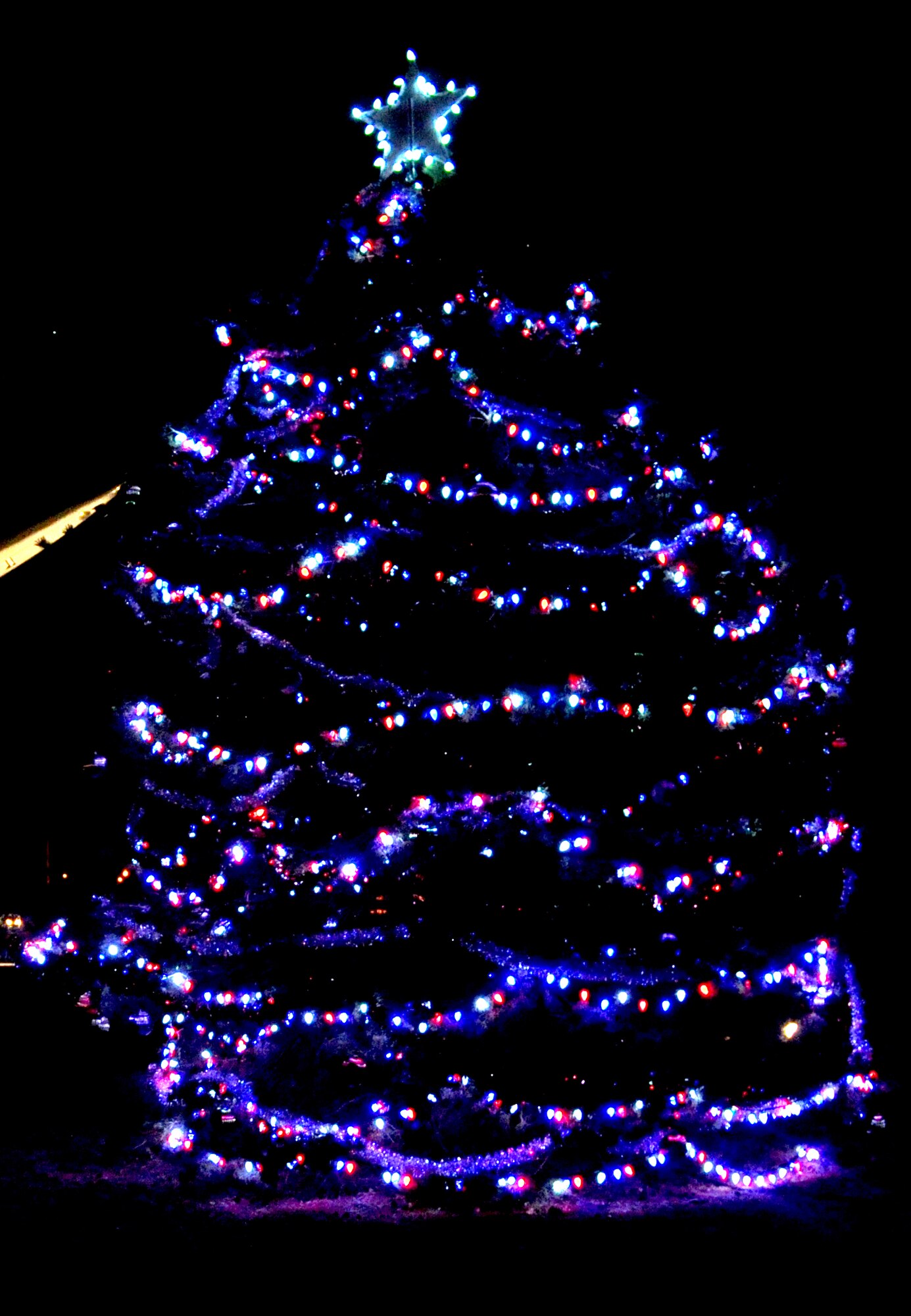 More than 235 Team Vance members attended the Wing Tree lighting ceremony Dec. 2 at Vance Air Force Base, Okla. They consumed 200 cookies and 18 gallons of hot chocolate and toured Air Force and Army equipment on display. (U.S. Air Force photo/ Airman 1st Class Frank John Casciotta)