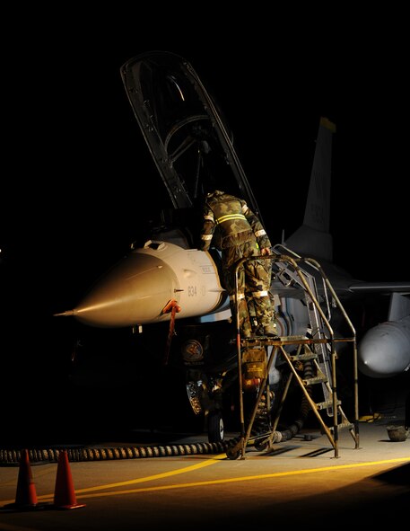 Airman 1st Class Joseph Campbell, 35th Aircraft Maintenance Squadron, performs maintenance on an F-16 Fighting Falcon during an operational readiness inspection, Misawa Air Base, Japan, Dec. 8, 2011. Pacific Air Forces Inspector General is evaluating the war fighting capability of Misawa's airmen. (U.S. Air Force photo/Airman 1st Class Kia Atkins/Released) 
