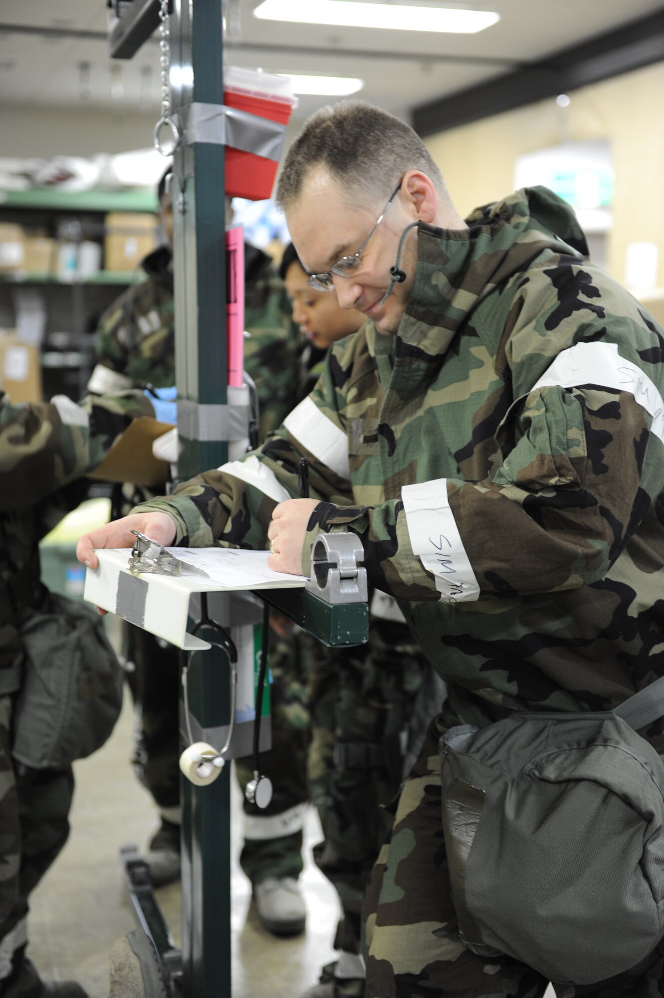 MISAWA AIR BASE, Japan - Maj. David Robinson, 35th Medical Operations Squadron, reads a patient's record during an operational readiness inspection here Dec. 7. Pacific Air Forces Inspector General is inspecting the war fighting capability of Misawa's airmen. (U.S. Air Force photo/Airman 1st Class Kia Atkins)