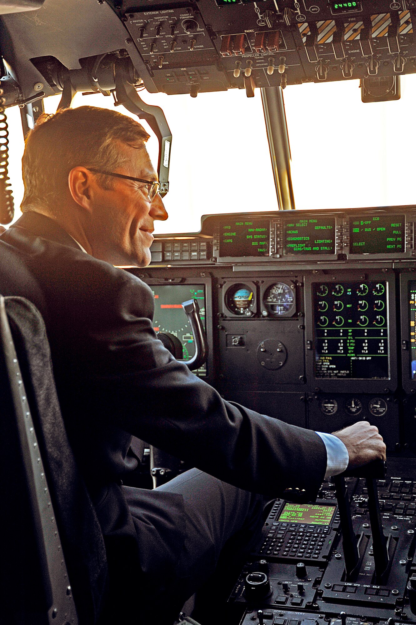 U.S. Air Force Chief Scientist, Dr. Mark T. Maybury, sits behind the controls of a WC-130J aircraft during his visit to the 53rd Weather Reconnaissance Squadron Dec. 1. (U.S. Air Force photo by Maj. Heather Newcomb)