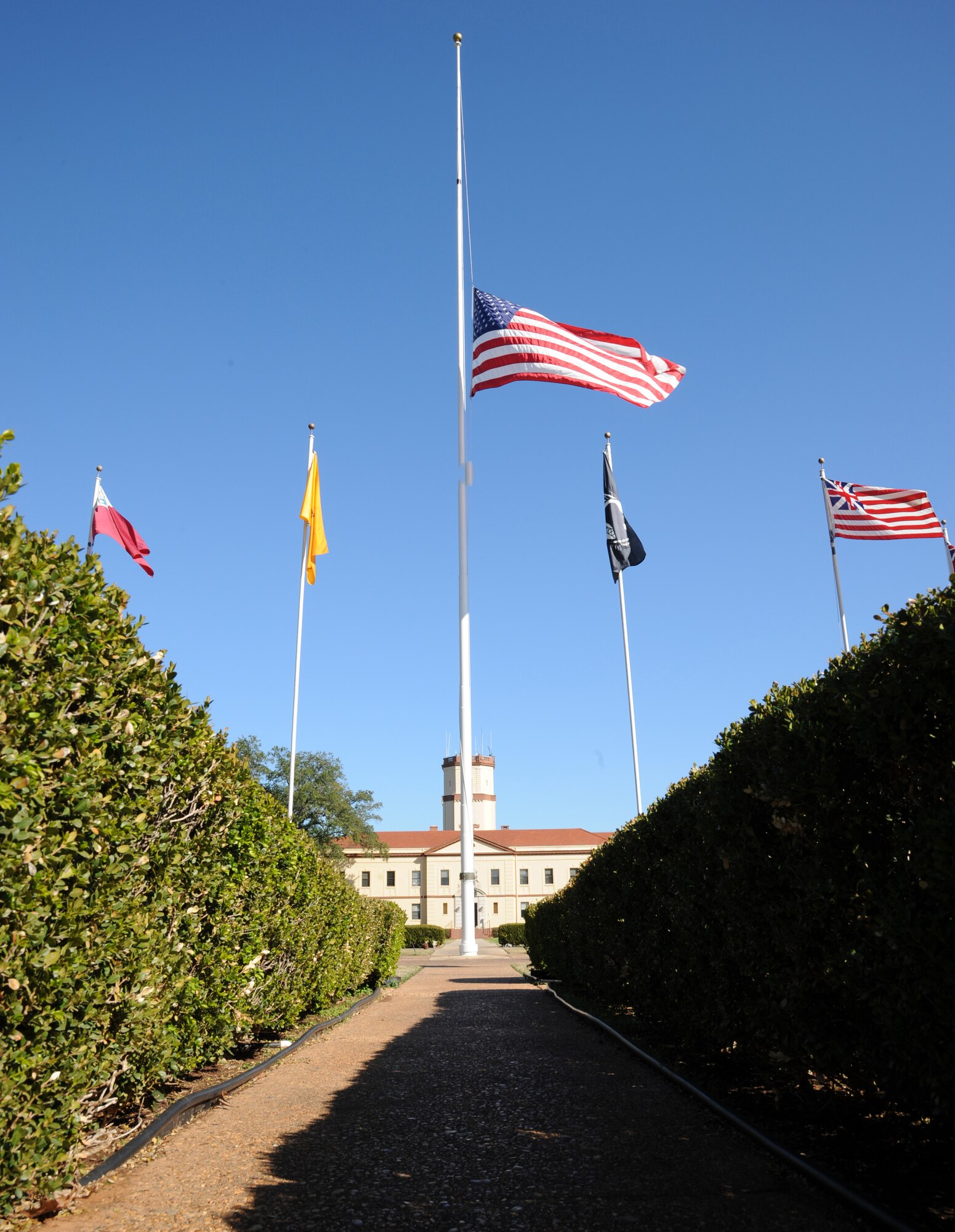 An American flag flies at half-staff on the 2nd Bomb Wing flagpole Dec. 7 on Barksdale Air Force Base. On this day 1941, the Japanese launched a deadly surprise attack on Pearl Harbor in Honolulu, Hawaii pulling the U.S. into World War II. December 7 is designated National Pearl Harbor Rememberance Day in honor of those American patriots who died as a result of their service at Pearl Harbor. (U.S. Air Force photo/Airman 1st Class Andrew Moua)(RELEASED)