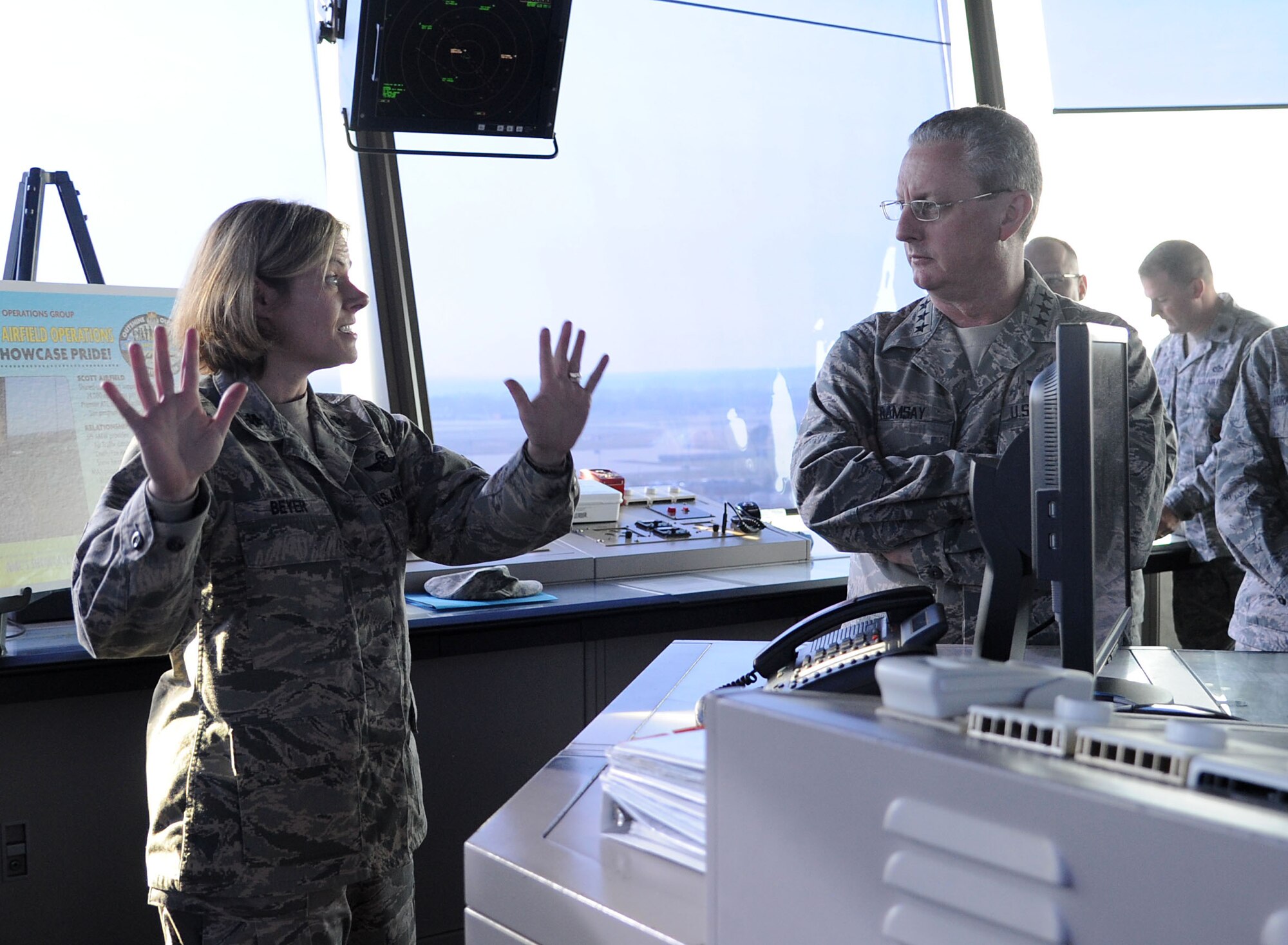 Lt. Gen. Mark Ramsay, 18th Air Force commander, meets with Lt. Col. Sara Beyer, Operations Support Squadron to discuss the relationship Scott has with Mid-America Airport and a few of the challenges it might have at Scott Air Force Base, Ill. Dec. 2. General Ramsay toured Scott AFB after recently taking command to familiarize himself with the mission and people involved with the 375th Air Mobility Wing. (U.S. Air Force photo/ Staff Sgt. Ryan Crane)