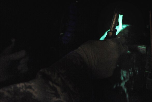 WHITEMAN AIR FORCE BASE, Mo. -- Senior Airman Brandon Gerst looks for surface defects under a black light Dec. 2, 2011. The black light causes particles, which are unseen to the human eye, to become florescent. Gerst is a non-destructive inspection technician assigned to the 509th Maintenance Squadron. (U.S. Air Force photo by Senior Airman Laura Goodgame)