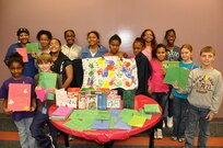 Children from Randolph's Youth Center display their hand-crafted holiday cards and a blanket they made to be sent to wounded warriors and troops deployed in Afghanistan.
(Courtesy photo)