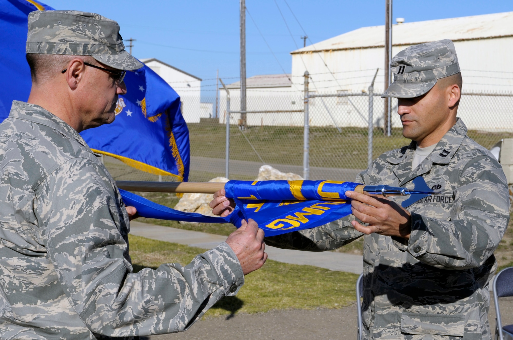 VANDENBERG AIR FORCE BASE, Calif. -- Col. Phillip Boroff, 798th Munitions Maintenance Group commander, and Capt. Angel Guerrero, 798th MUMG Detachment 1, maintenance operation officer, retire the detachment guidon during a deactivation ceremony here Tuesday, Dec. 6, 2011. The deactivation is due to a major command change and realignment of functions placing the command, control and authority for the operational mission with the 576th Flight Test Squadron here.
U.S. Air Force photo/Jerry E. Clemens Jr.)
 

 