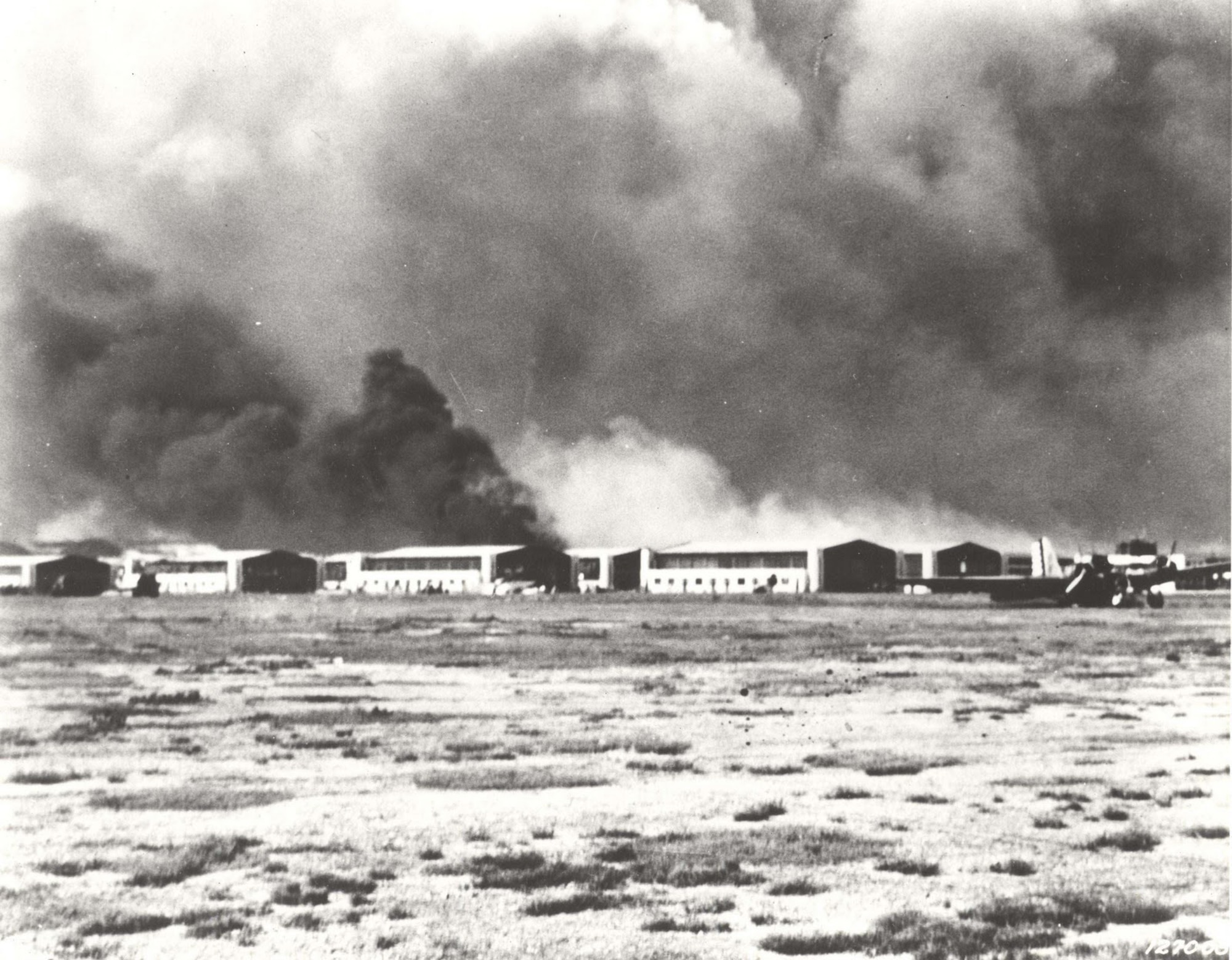 Hickam row after bombing of Hicakm Field December 7, 1941 as viewed from the flight line. (Courtesy photo)