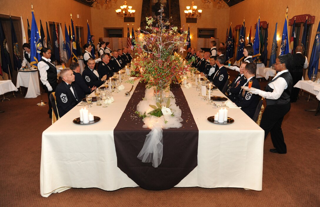 BARKSDALE AIR FORCE BASE, La. - Airmen volunteers ceremoniously served a seven-course meal during the inaugural Air Force Global Strike Command Heritage Dinner in which every aspect from the decorations and table displays to the distance between the chairs have historical significance to the nuclear enterprise. AFGSC commander, Lt. Gen. James Kowalski, hosted the dinner to foster pride in the nuclear heritage and mission for the command's wing and numbered Air Force commanders and command chief master sergeants that met at Barksdale Air Force Base for a commander's conference. (U.S. Air Force photo by Master Sgt. Corey A. Clements)
