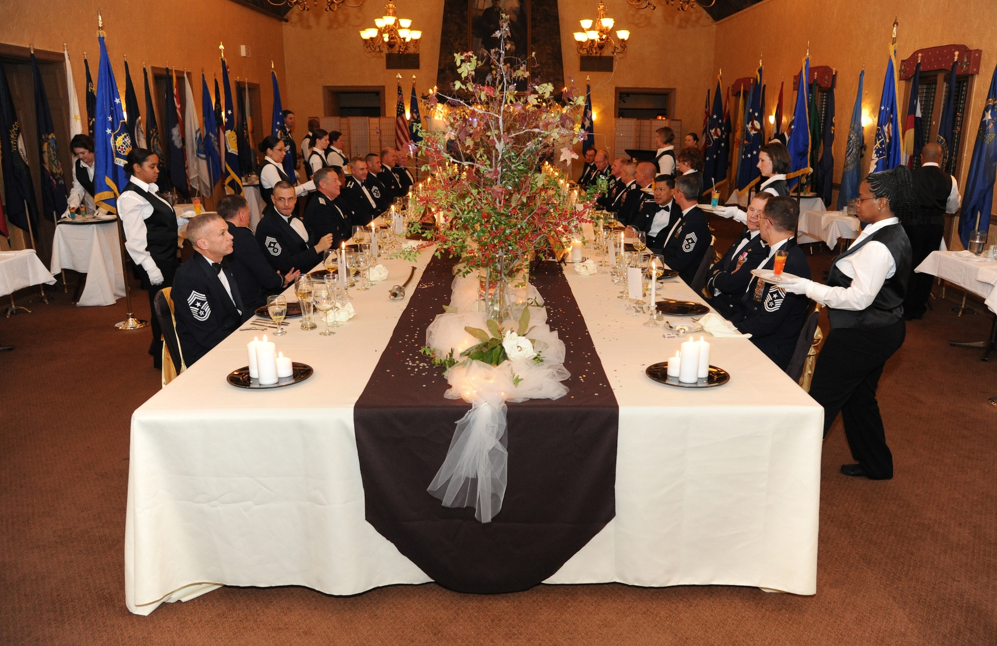 BARKSDALE AIR FORCE BASE, La. - Airmen volunteers ceremoniously served a seven-course meal during the inaugural Air Force Global Strike Command Heritage Dinner in which every aspect from the decorations and table displays to the distance between the chairs have historical significance to the nuclear enterprise. AFGSC commander, Lt. Gen. James Kowalski, hosted the dinner to foster pride in the nuclear heritage and mission for the command's wing and numbered Air Force commanders and command chief master sergeants that met at Barksdale Air Force Base for a commander's conference. (U.S. Air Force photo by Master Sgt. Corey A. Clements)