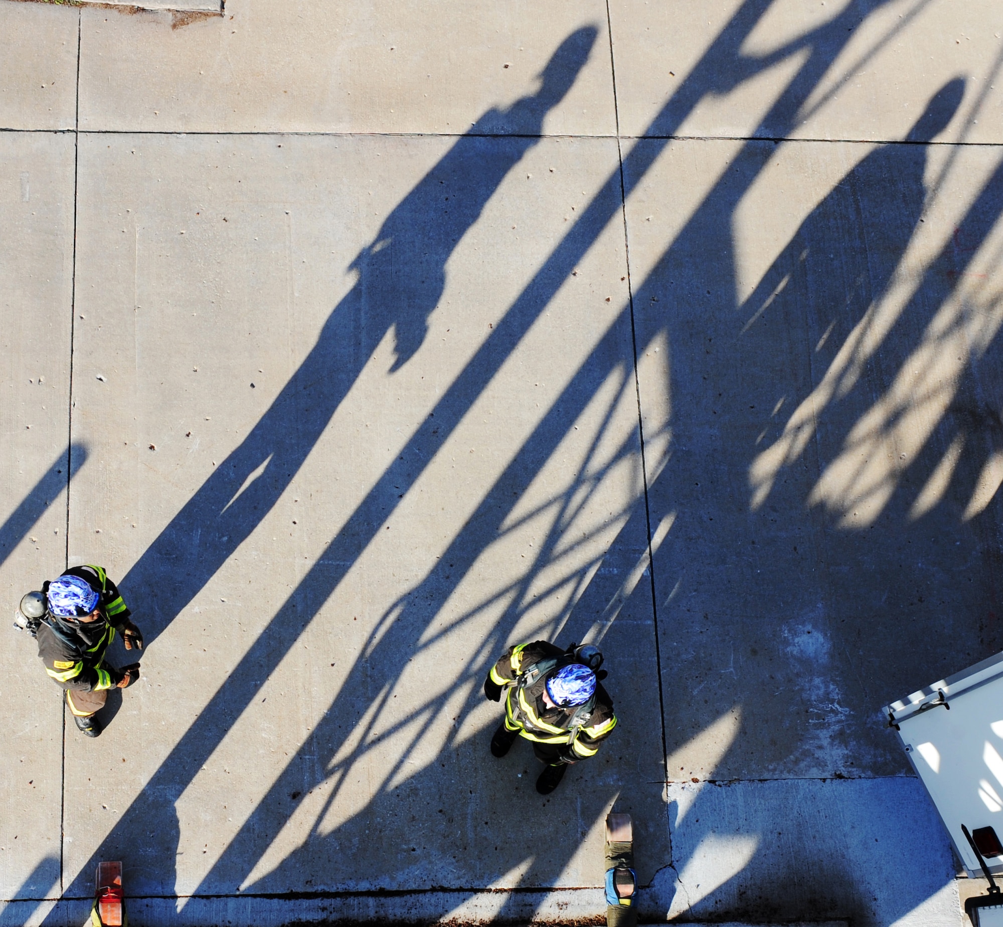 WHITEMAN AIR FORCE BASE, Mo. - - Staff Sgt. Derrick Allen and Senior Airman Timothy Vanden Haak prepare to run up a five story tower in full fire protection gear to practice honing their skills Nov. 30. The Whiteman AFB team of Allen, Airman 1st Class Anthony Beaudry, Master Sgt. Mark Belton, and Christopher Finkes earned the silver medal this year at the world firefighter competition at Myrtle Beach, S.C. The challenge requires maximum effort in minimal time as it simulates the exertion needed to fight a fire and rescue a victim on a timed course. Allen and Vanden Haak are fire protection specialist assigned to the 509th Civil Engineer Squadron, Fire Protection Flight. (U.S. Air Force photo/Senior Airman Laura Goodgame) 